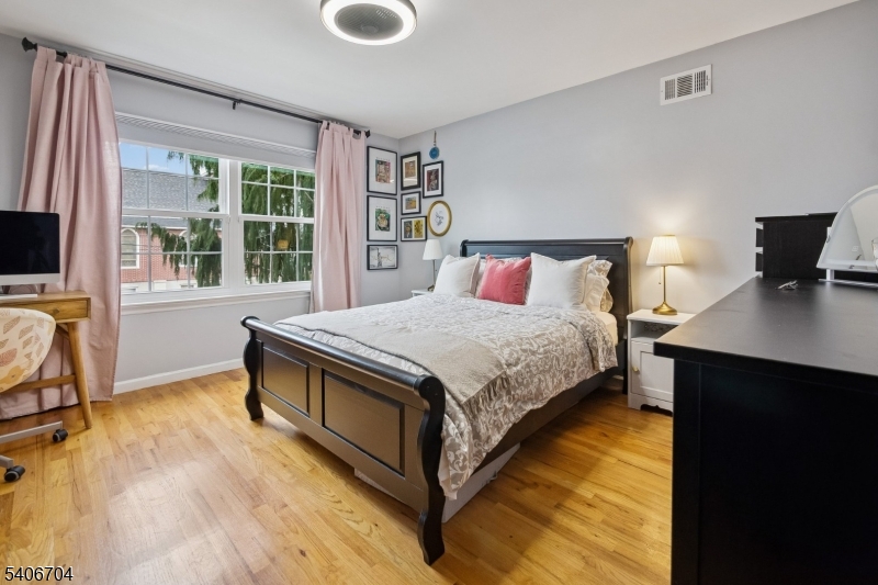 111 Todd Street Linden, NJ 07036 - Photo 15 of 34 a bedroom with a bed and a desk