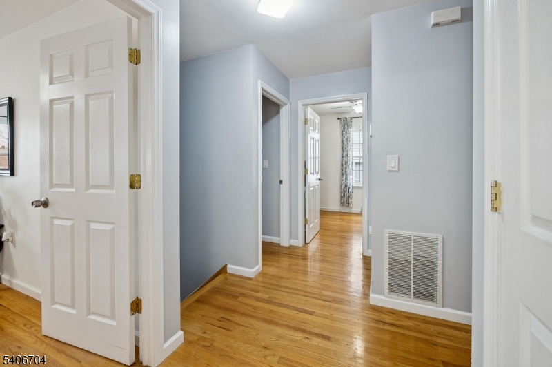 111 Todd Street Linden, NJ 07036 - Photo 16 of 34 wooden floor with white walls