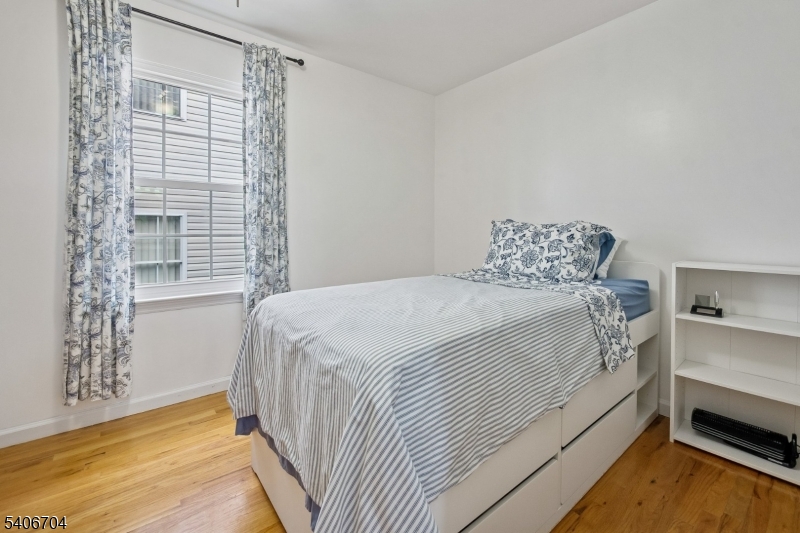 111 Todd Street Linden, NJ 07036 - Photo 21 of 34 a bedroom with a bed and a window