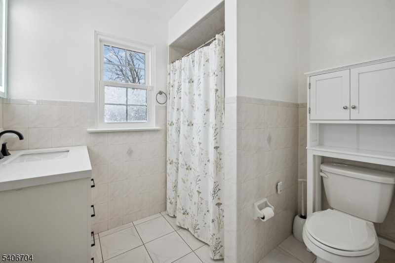111 Todd Street Linden, NJ 07036 - Photo 24 of 34 a bathroom with a sink toilet and shower