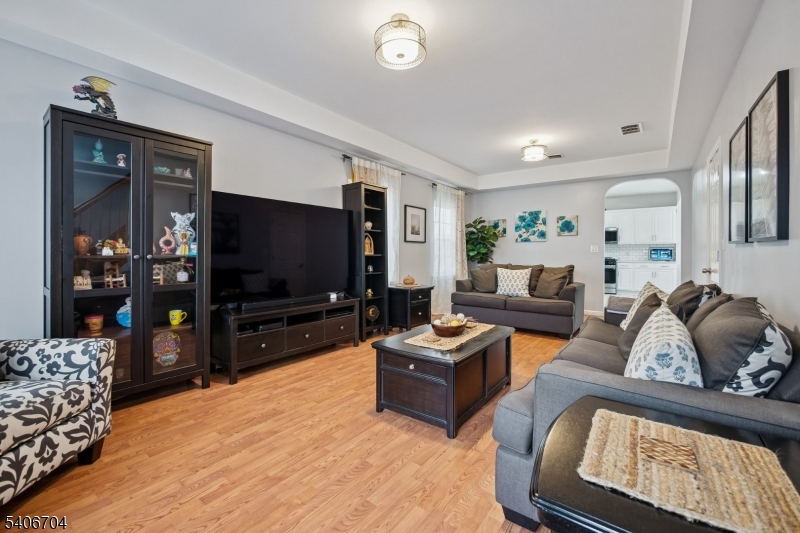 111 Todd Street Linden, NJ 07036 - Photo 3 of 34 a living room with furniture and a flat screen tv