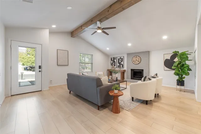 a living room with furniture and a window