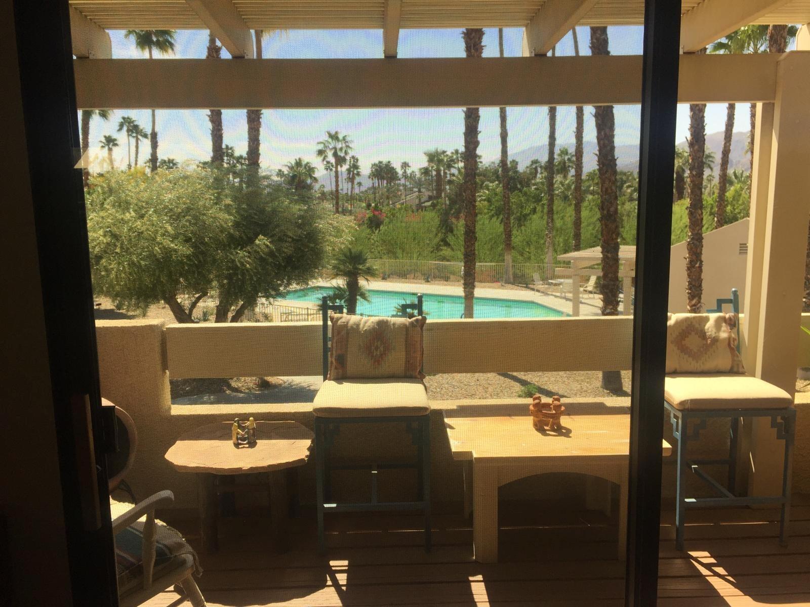 8 Mission Court Rancho Mirage, CA 92270 - Photo 12 of 17 a view of a balcony with table and chairs