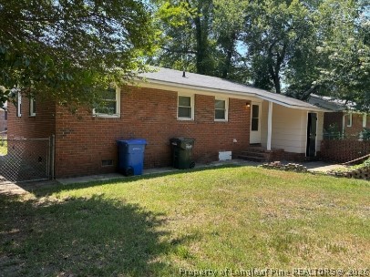 1070 Rulnick Street Fayetteville, NC 28304 - Photo 14 of 15 a backyard of a house with lots of green space