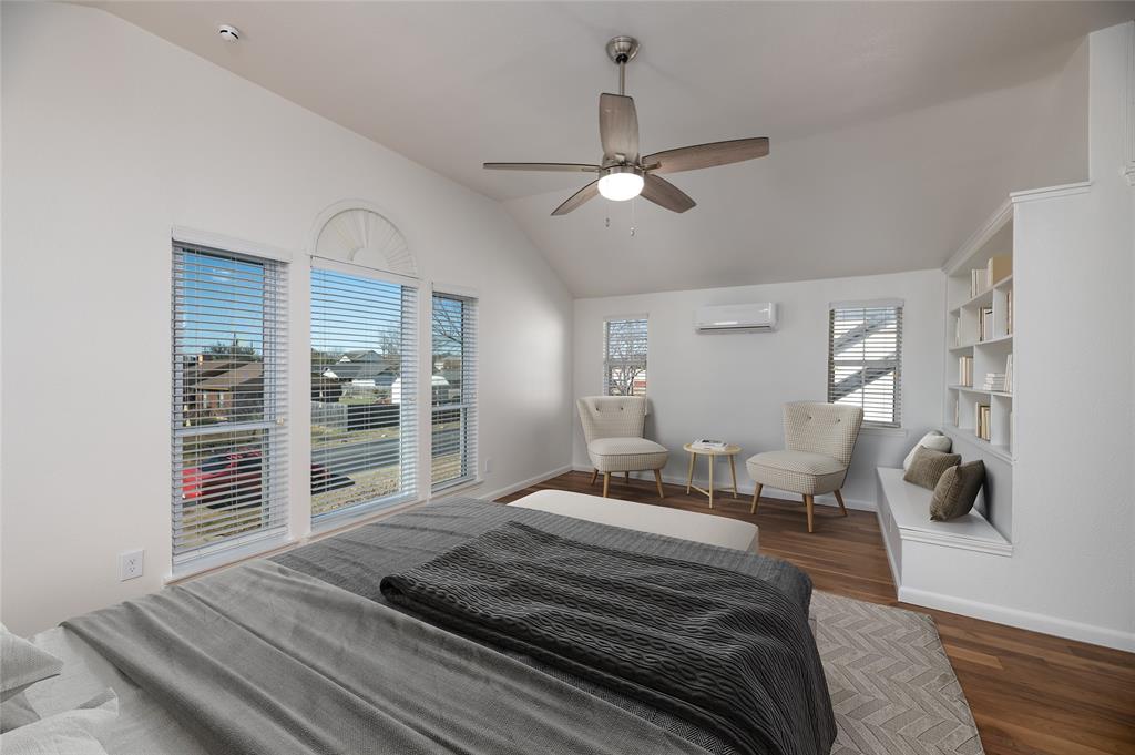 485 Ashley Lane Roanoke, TX 76262 - Photo 15 of 28 a bedroom with bed and wooden floor