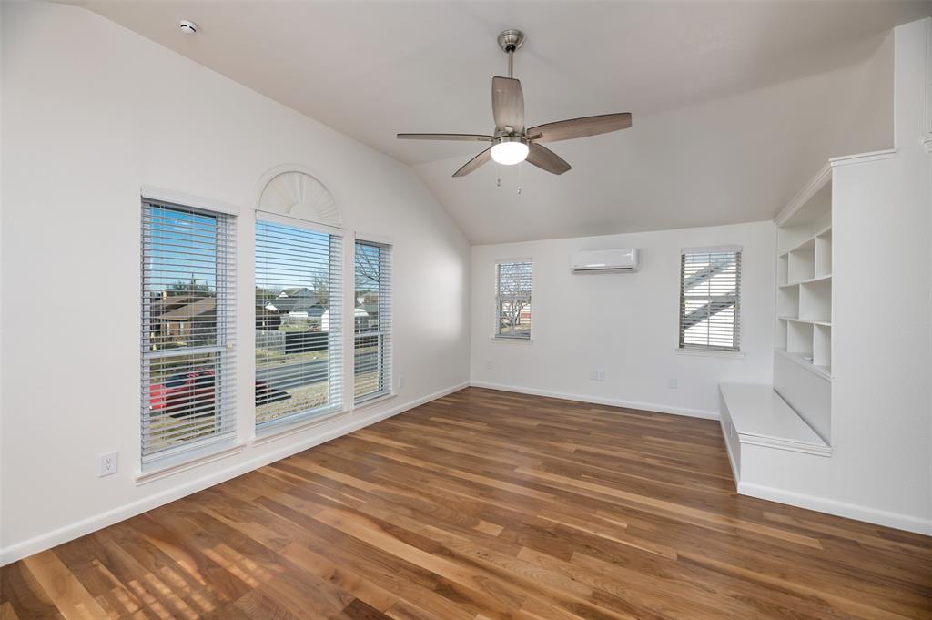 485 Ashley Lane Roanoke, TX 76262 - Photo 16 of 28 a view of empty room with wooden floor and fan