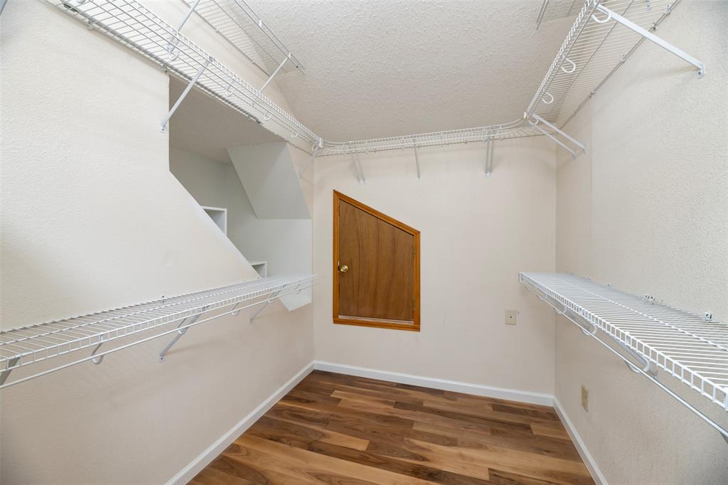 485 Ashley Lane Roanoke, TX 76262 - Photo 21 of 28 a view of hallway with stairs and wooden floor