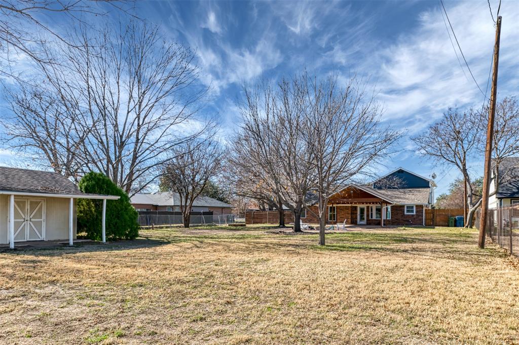 485 Ashley Lane Roanoke, TX 76262 - Photo 25 of 28 a front view of a house with a yard