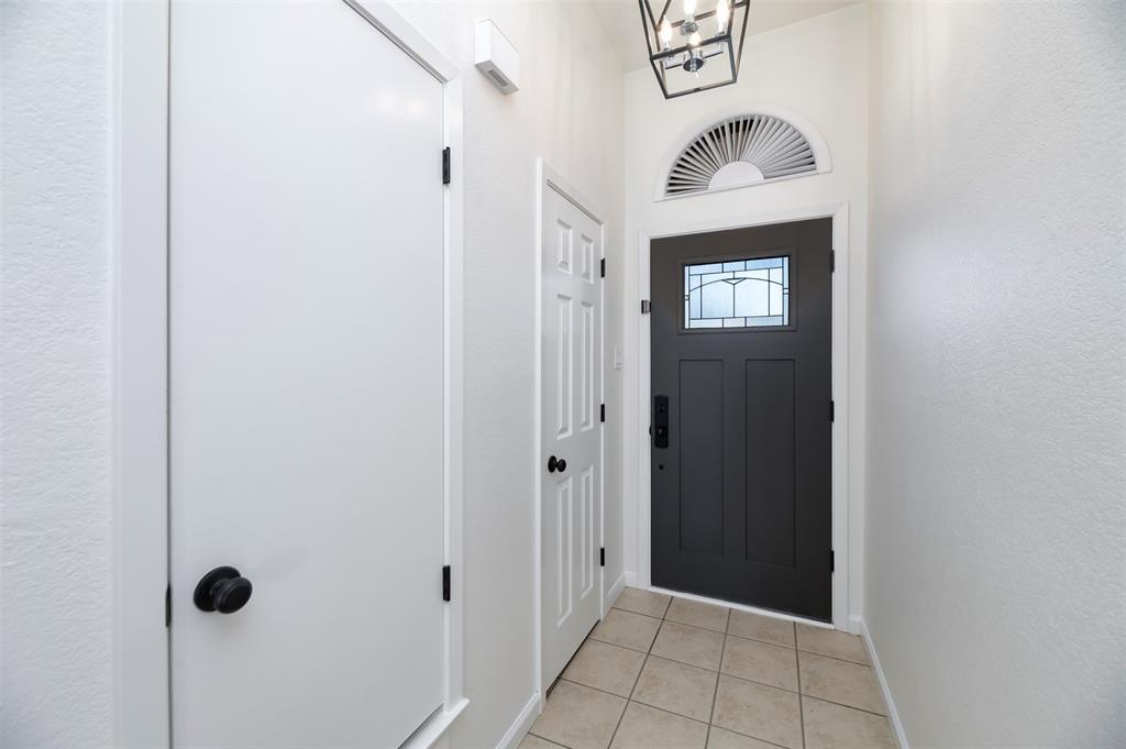 485 Ashley Lane Roanoke, TX 76262 - Photo 4 of 28 a view of a hallway with wooden floor