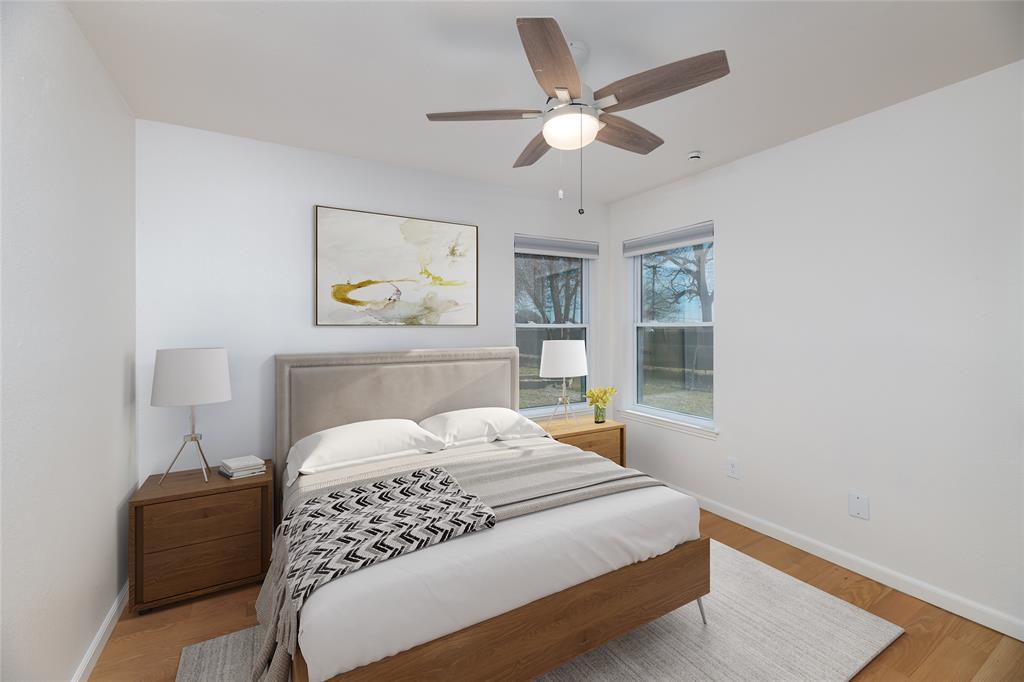 485 Ashley Lane Roanoke, TX 76262 - Photo 9 of 28 a bedroom with a large bed and a chandelier