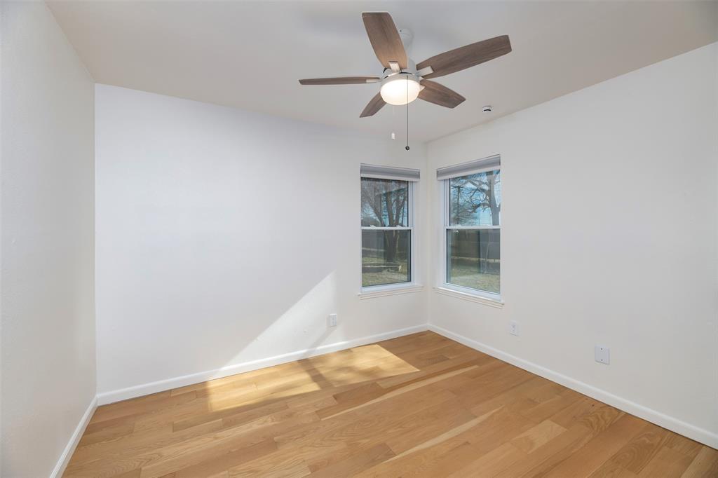 485 Ashley Lane Roanoke, TX 76262 - Photo 10 of 28 an empty room with wooden floor and windows
