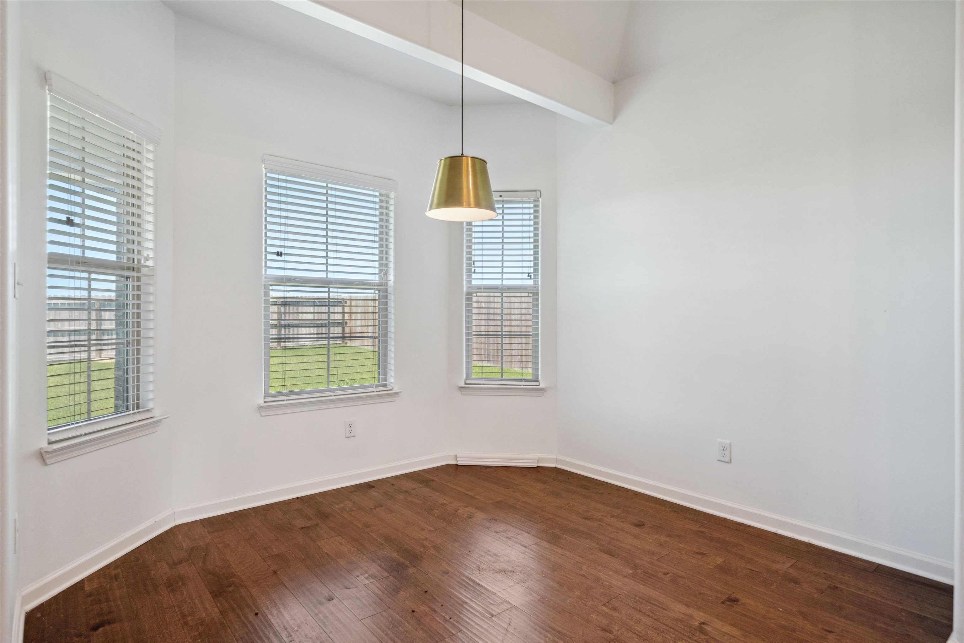 75 Cypress Point Road Oakland, TN 38060 - Photo 11 of 38 a view of an empty room with wooden floor and a window