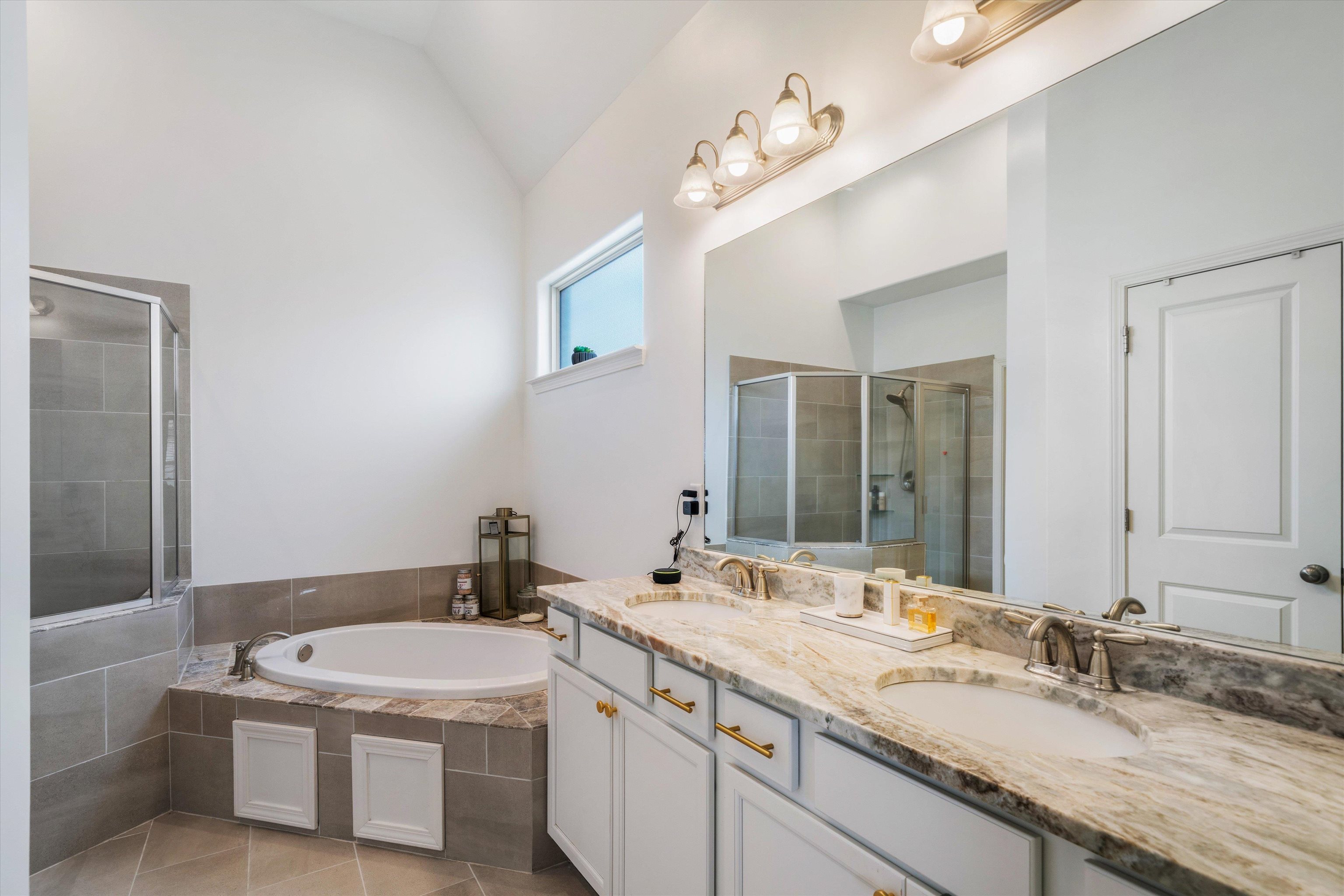 75 Cypress Point Road Oakland, TN 38060 - Photo 17 of 38 a bathroom with a sink double vanity granite tub and a mirror