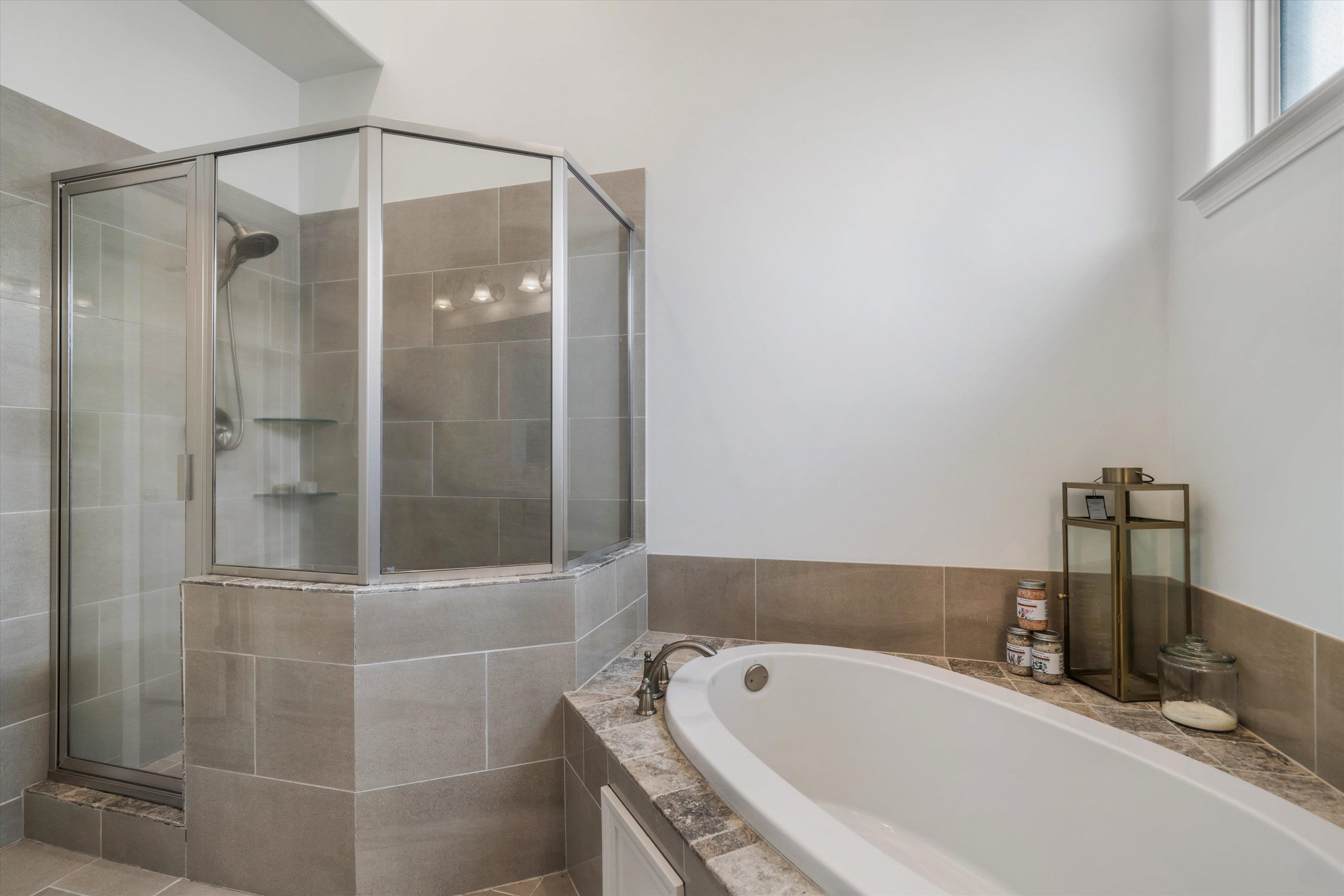 75 Cypress Point Road Oakland, TN 38060 - Photo 18 of 38 a bathroom with a tub and shower