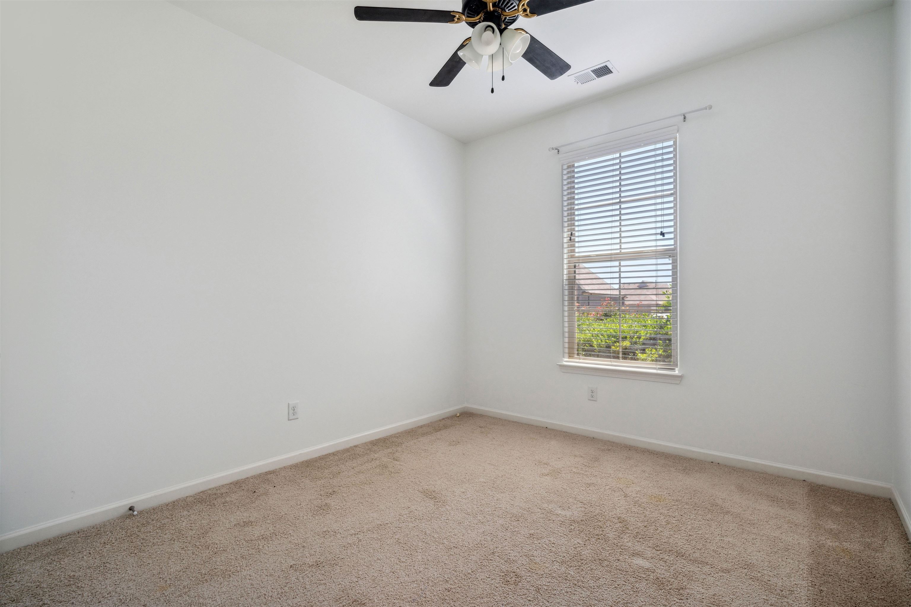 75 Cypress Point Road Oakland, TN 38060 - Photo 20 of 38 an empty room with a window and a ceiling fan