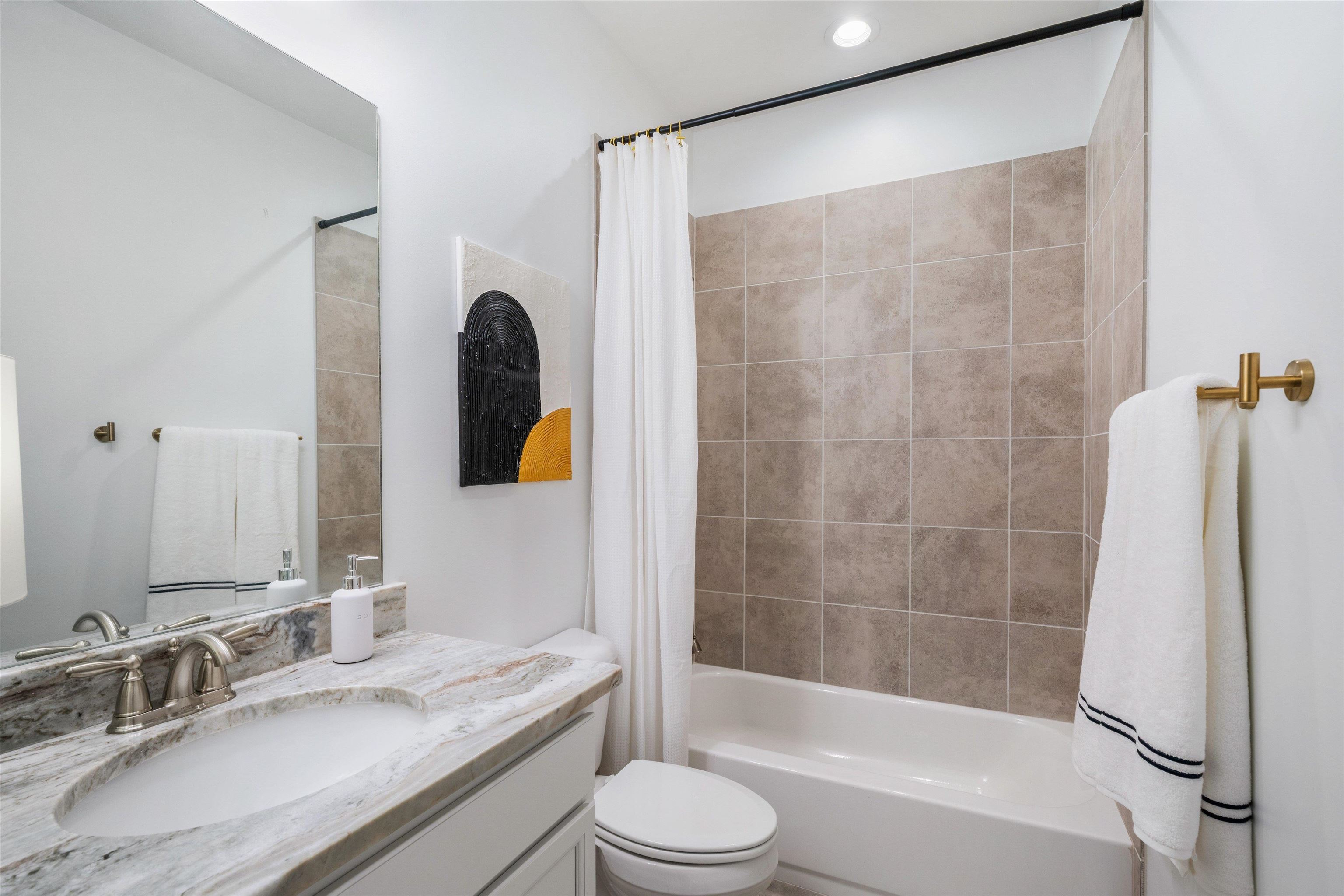 75 Cypress Point Road Oakland, TN 38060 - Photo 21 of 38 a bathroom with a granite countertop sink toilet and shower