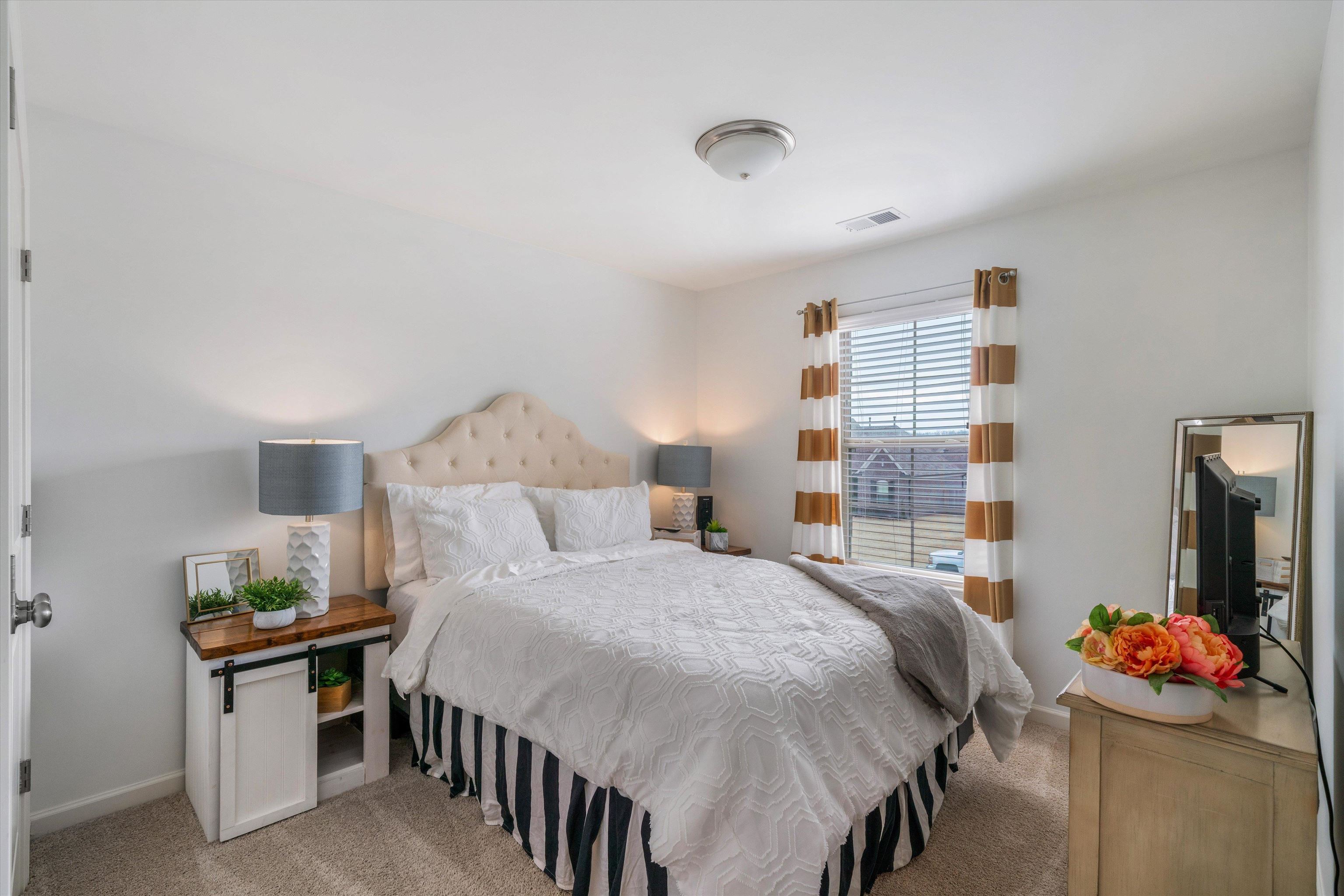 75 Cypress Point Road Oakland, TN 38060 - Photo 22 of 38 a bedroom with a bed and a table