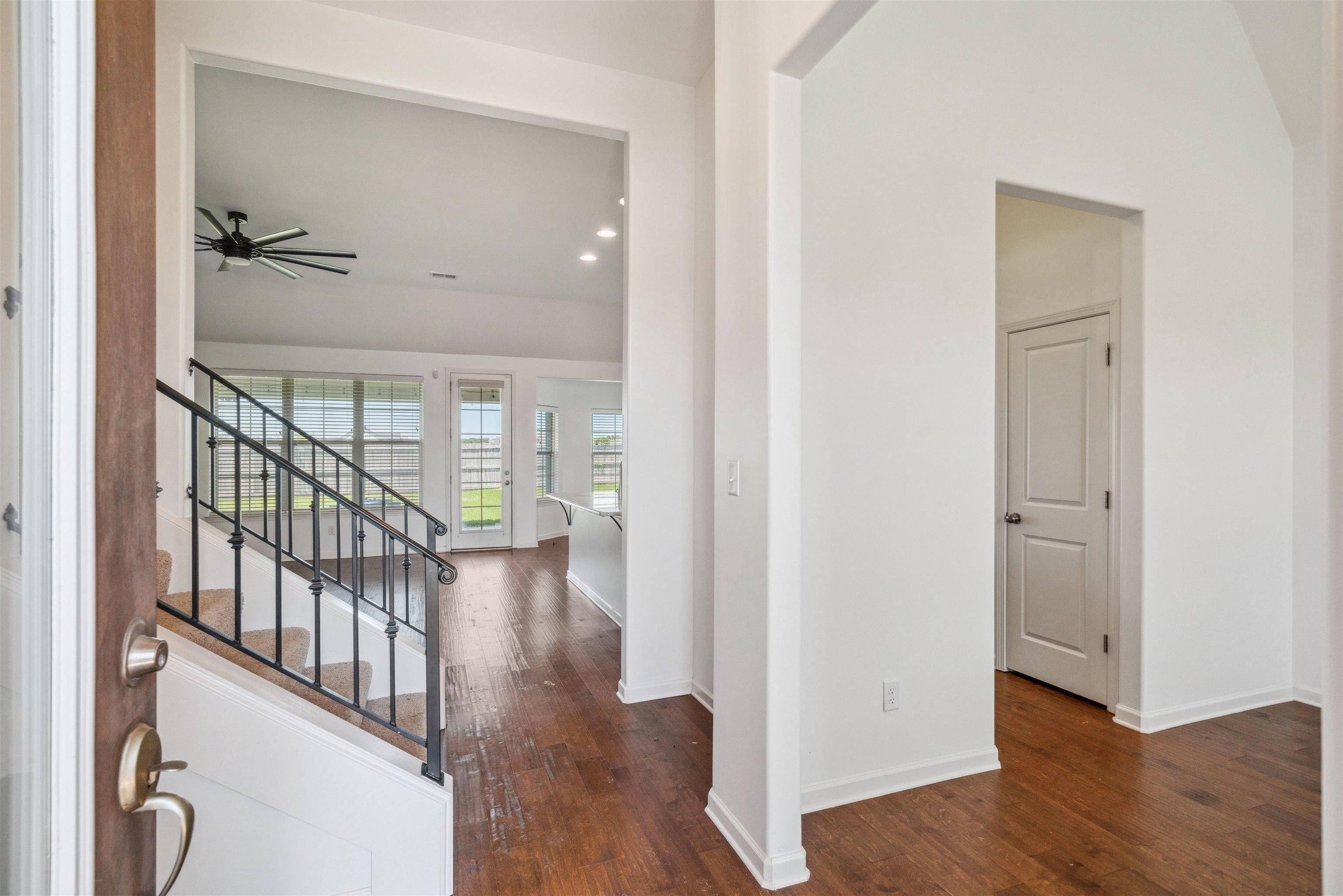 75 Cypress Point Road Oakland, TN 38060 - Photo 28 of 38 a view of a hallway with wooden floor and stairs