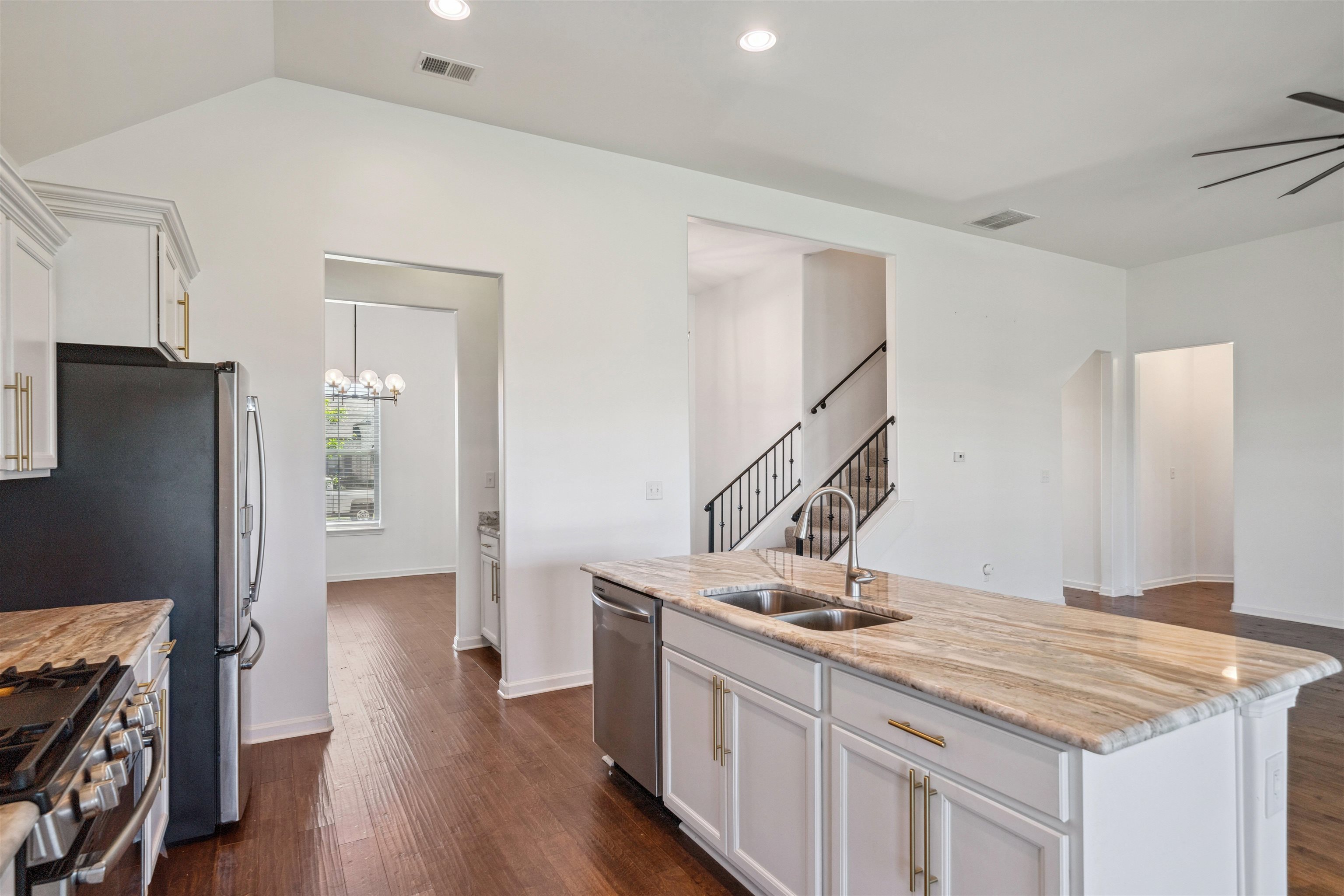 75 Cypress Point Road Oakland, TN 38060 - Photo 34 of 38 a kitchen with stainless steel appliances granite countertop a sink stove and refrigerator