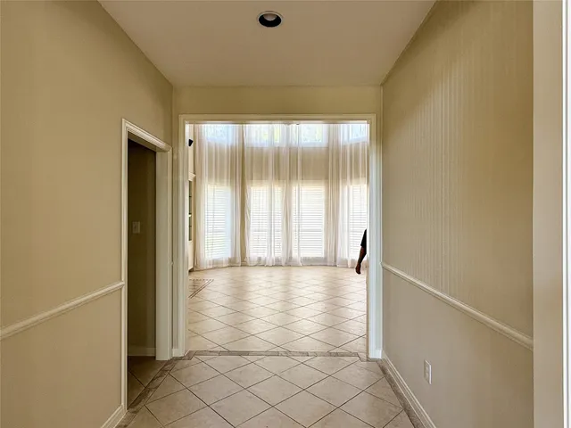 a view of staircase with white walls and a next to a window