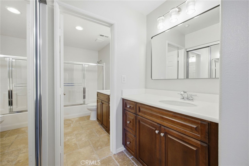 3603 Jetty Carlsbad, CA 92010 - Photo 14 of 43 a bathroom with a sink a toilet and shower