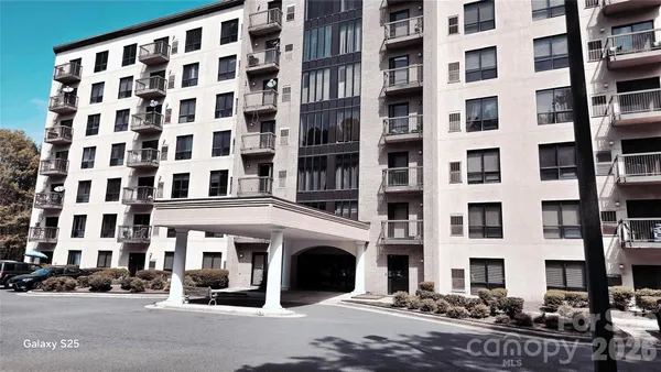 a view of a building with a street