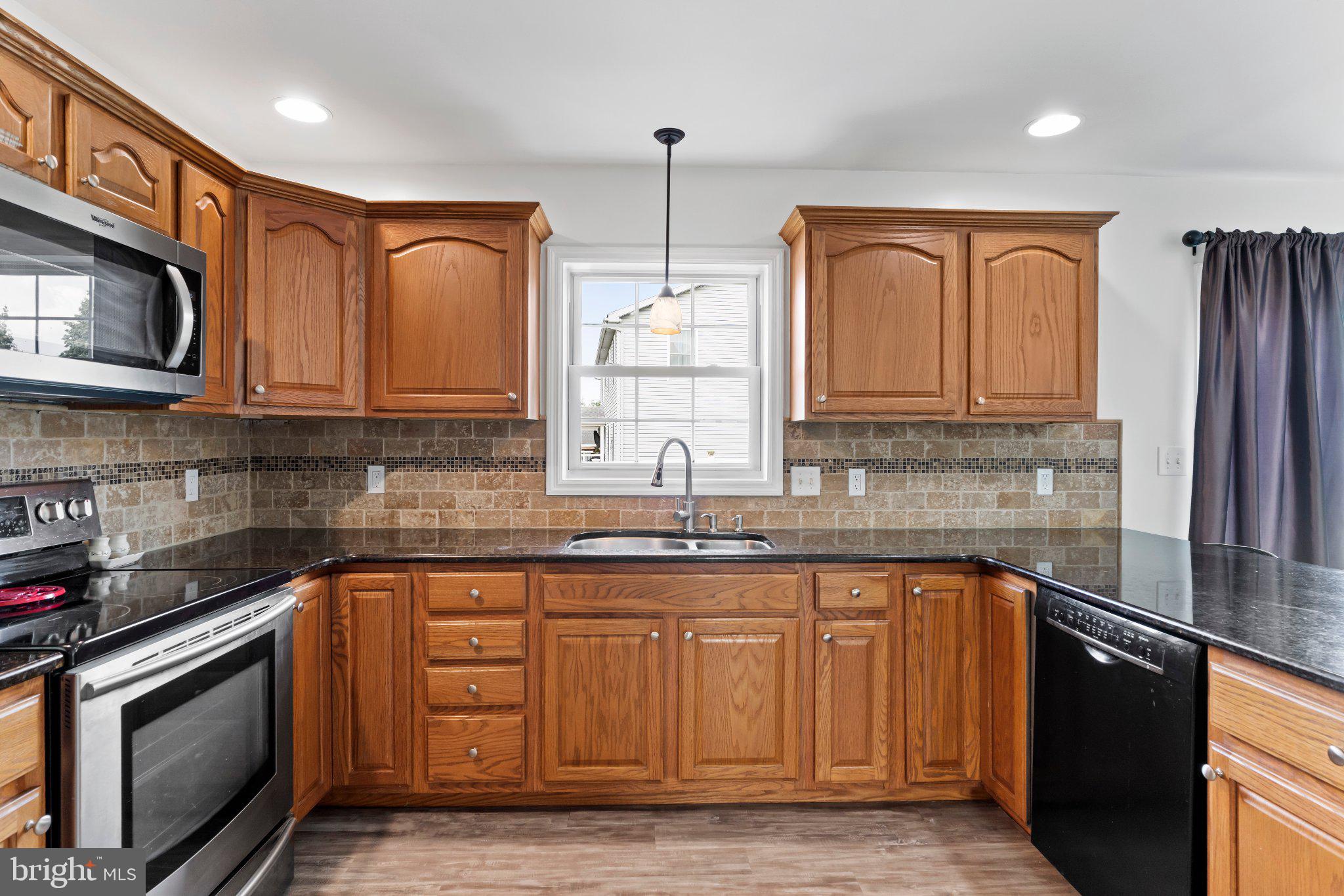 222 Chester Road Enola, PA 17025 - Photo 20 of 44 Warm wood tones in a modern kitchen.