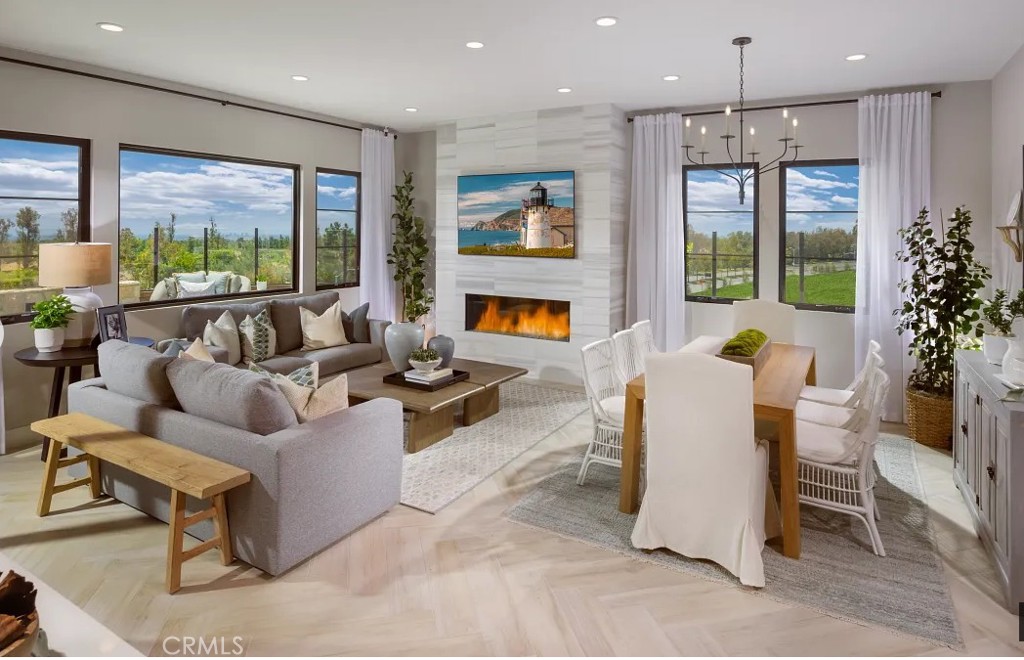416 Milpas Irvine, CA 92602 - Photo 1 of 7 a living room with fireplace furniture and a large window