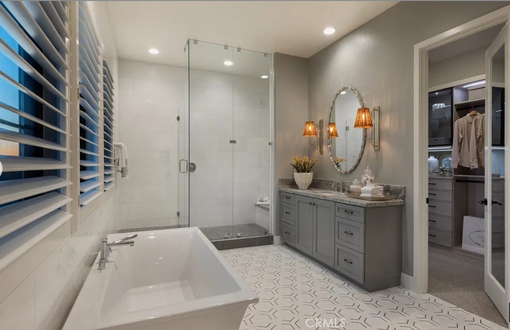 416 Milpas Irvine, CA 92602 - Photo 5 of 7 a bathroom with a tub sink and mirror