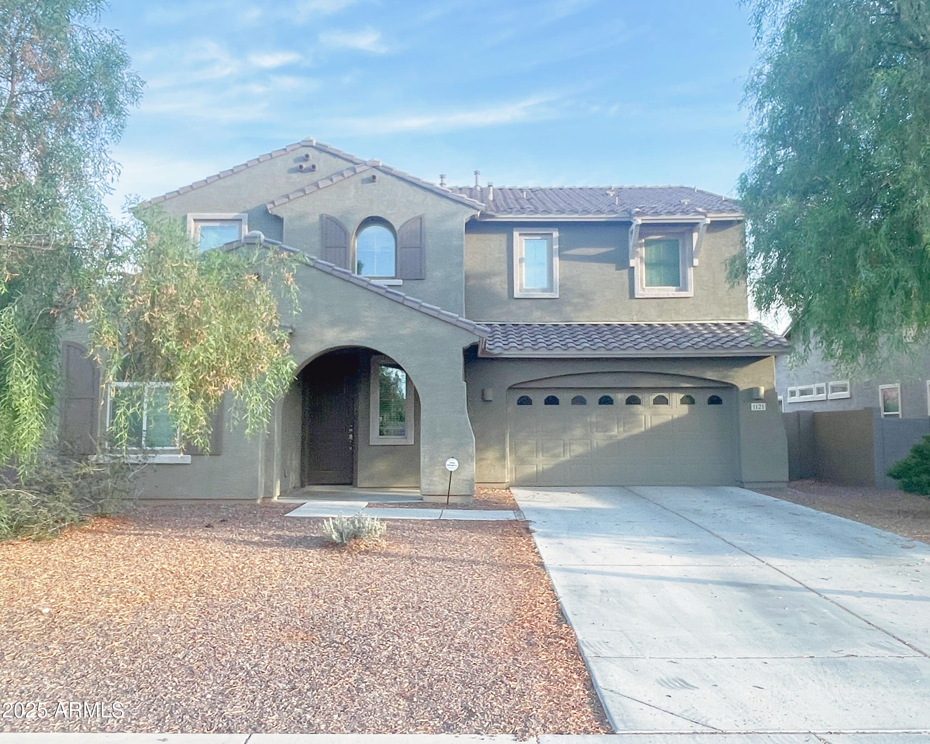 1121 East Regent Drive Gilbert, AZ 85298 - Photo 1 of 23 a view of outdoor space yard and front view of a house