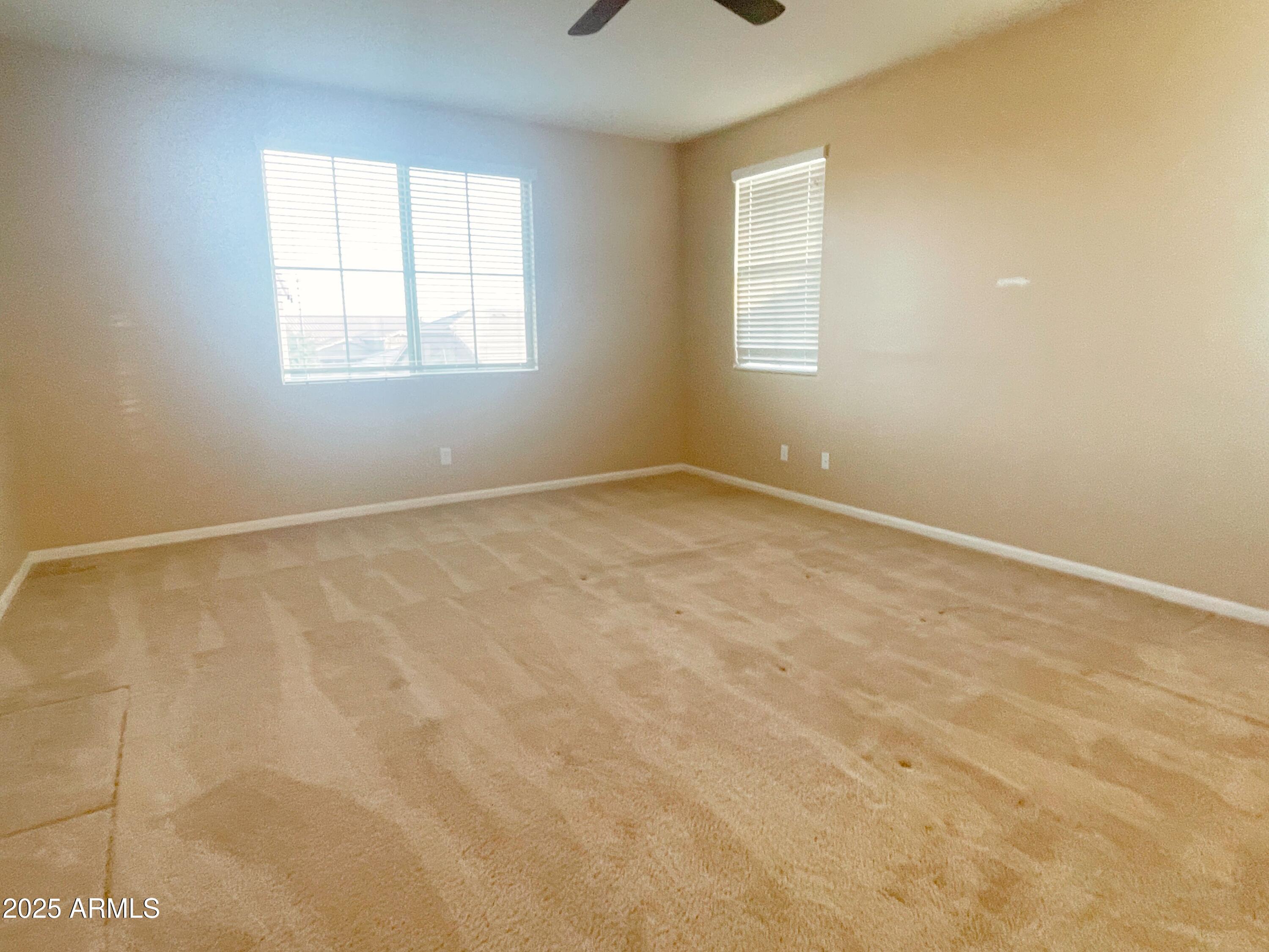 1121 East Regent Drive Gilbert, AZ 85298 - Photo 12 of 23 an empty room with windows