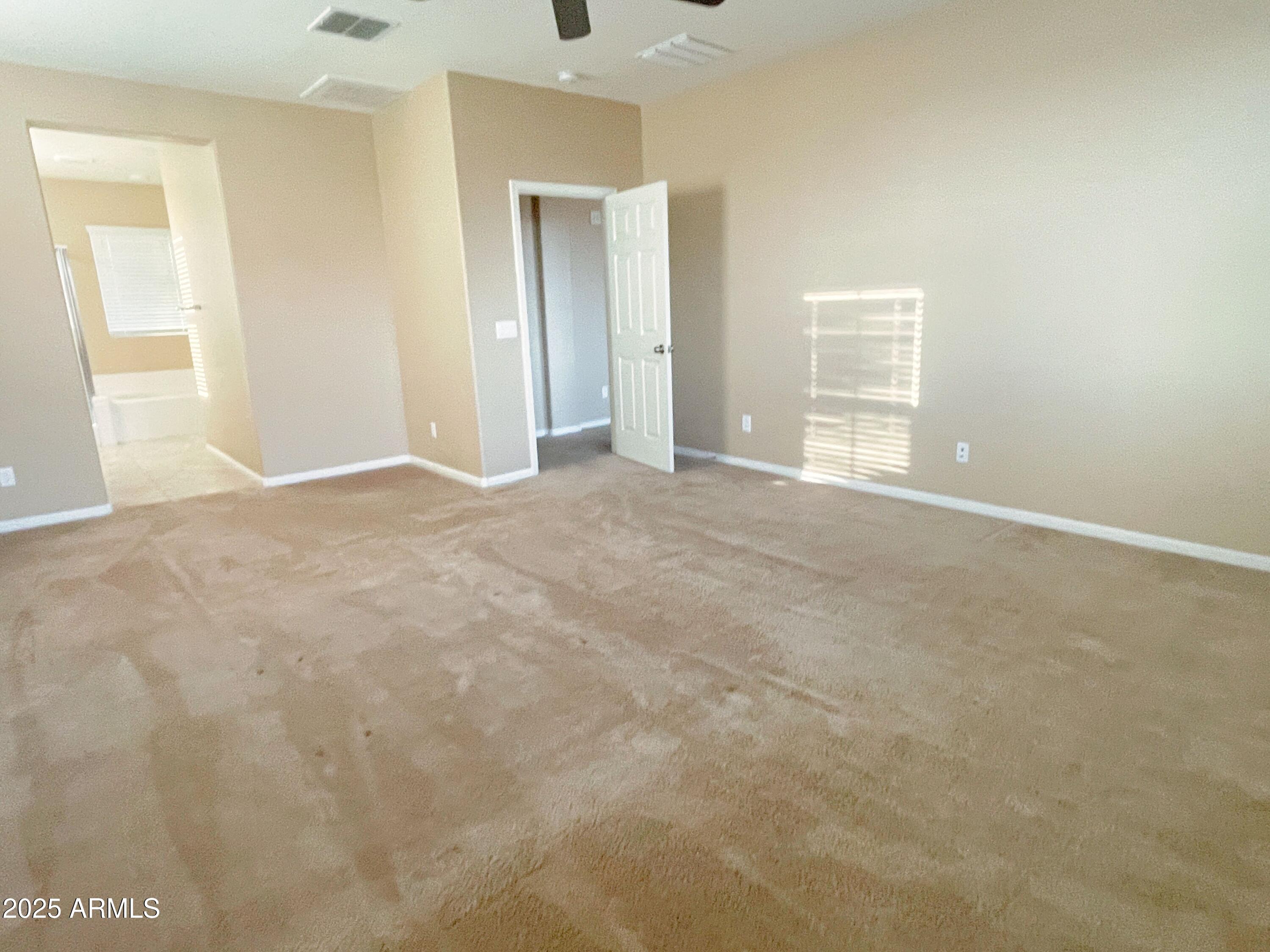 1121 East Regent Drive Gilbert, AZ 85298 - Photo 13 of 23 a view of an empty room with a window
