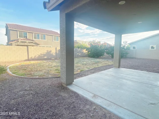 a view of a room wooden floor and front door