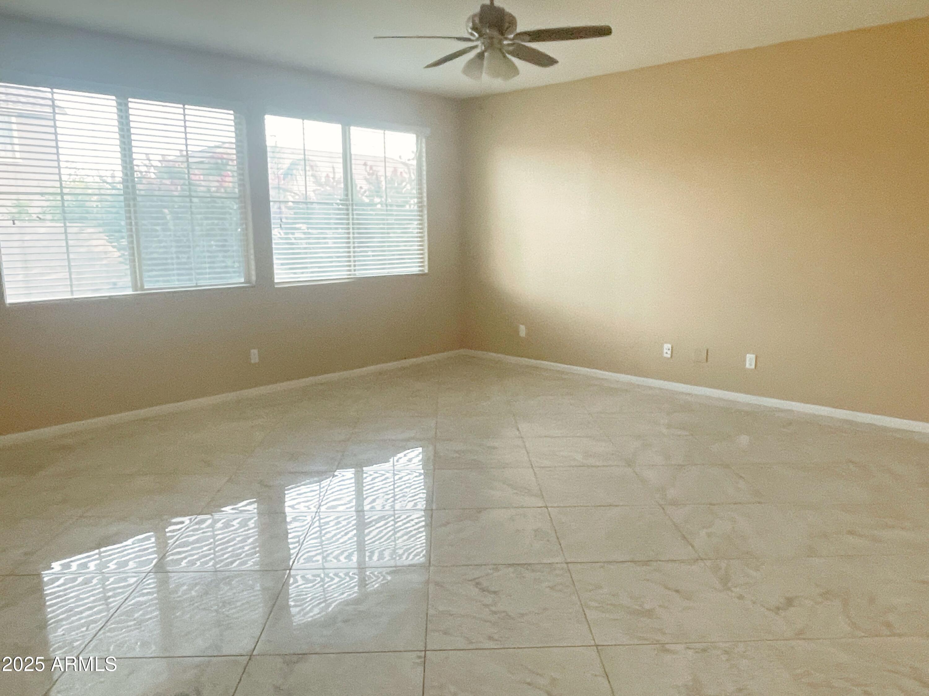 1121 East Regent Drive Gilbert, AZ 85298 - Photo 7 of 23 a view of an empty room with a window