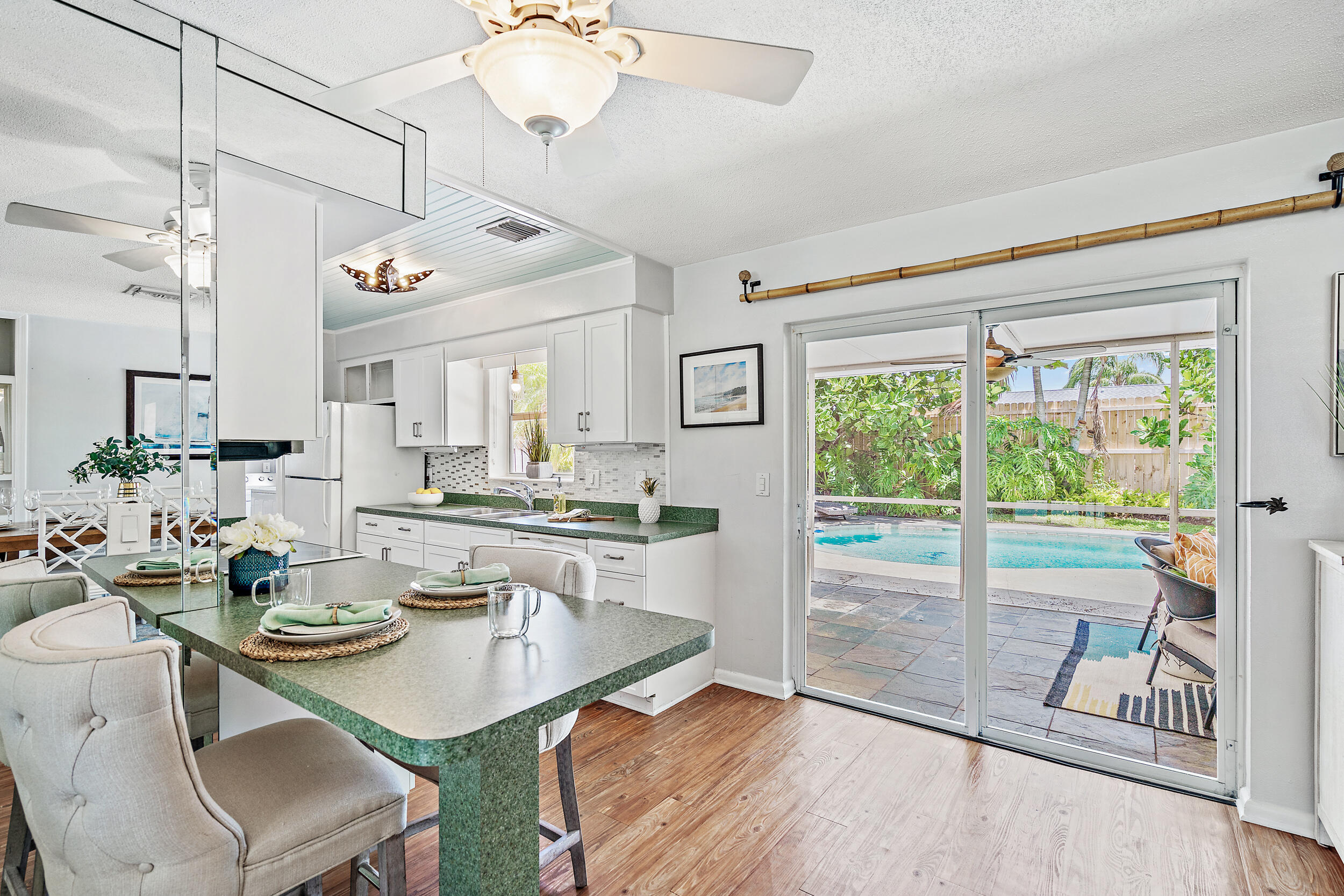 4171 Mark Street Jupiter, FL 33469 - Photo 9 of 26 Kitchen Area with Patio Access