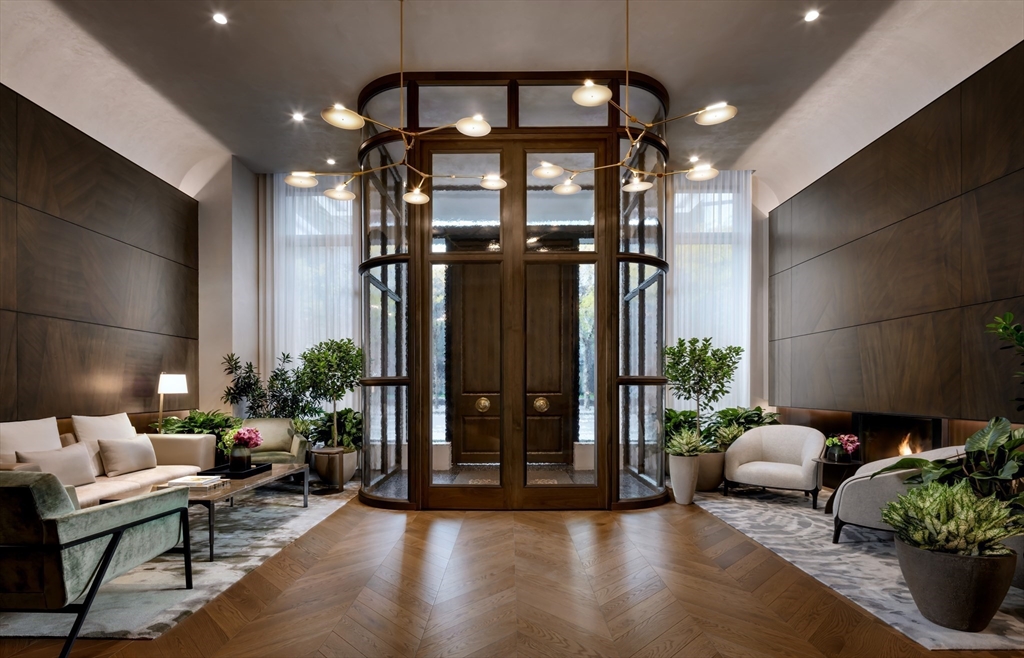 40 Trinity Place, Unit 30D Boston, MA 02116 - Photo 21 of 39 a lobby with furniture and potted plants