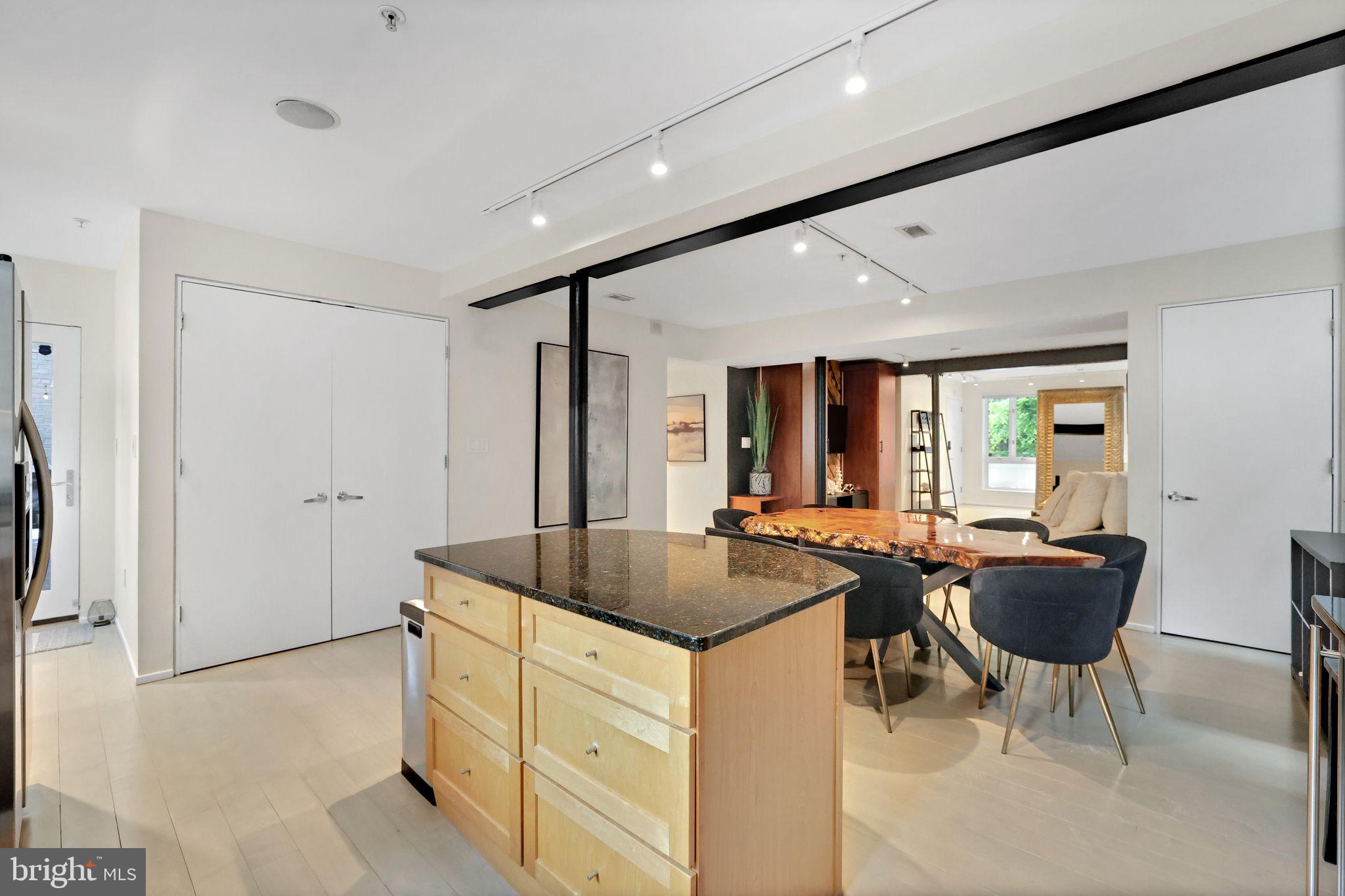 2311 15th Street Northwest, Unit 2 Washington, DC 20009 - Photo 13 of 37 a kitchen with sink refrigerator and couch