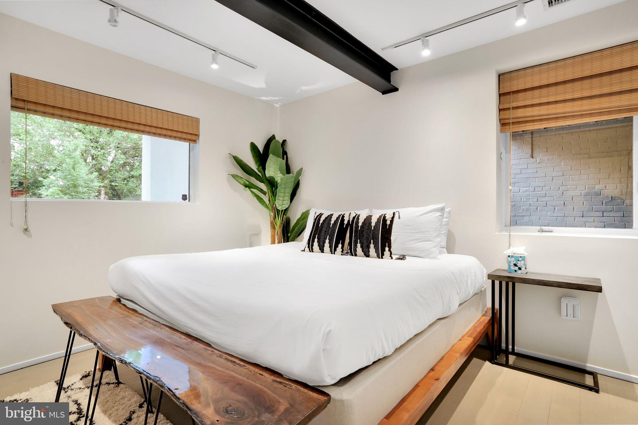 2311 15th Street Northwest, Unit 2 Washington, DC 20009 - Photo 18 of 37 a bedroom with a bed and a table