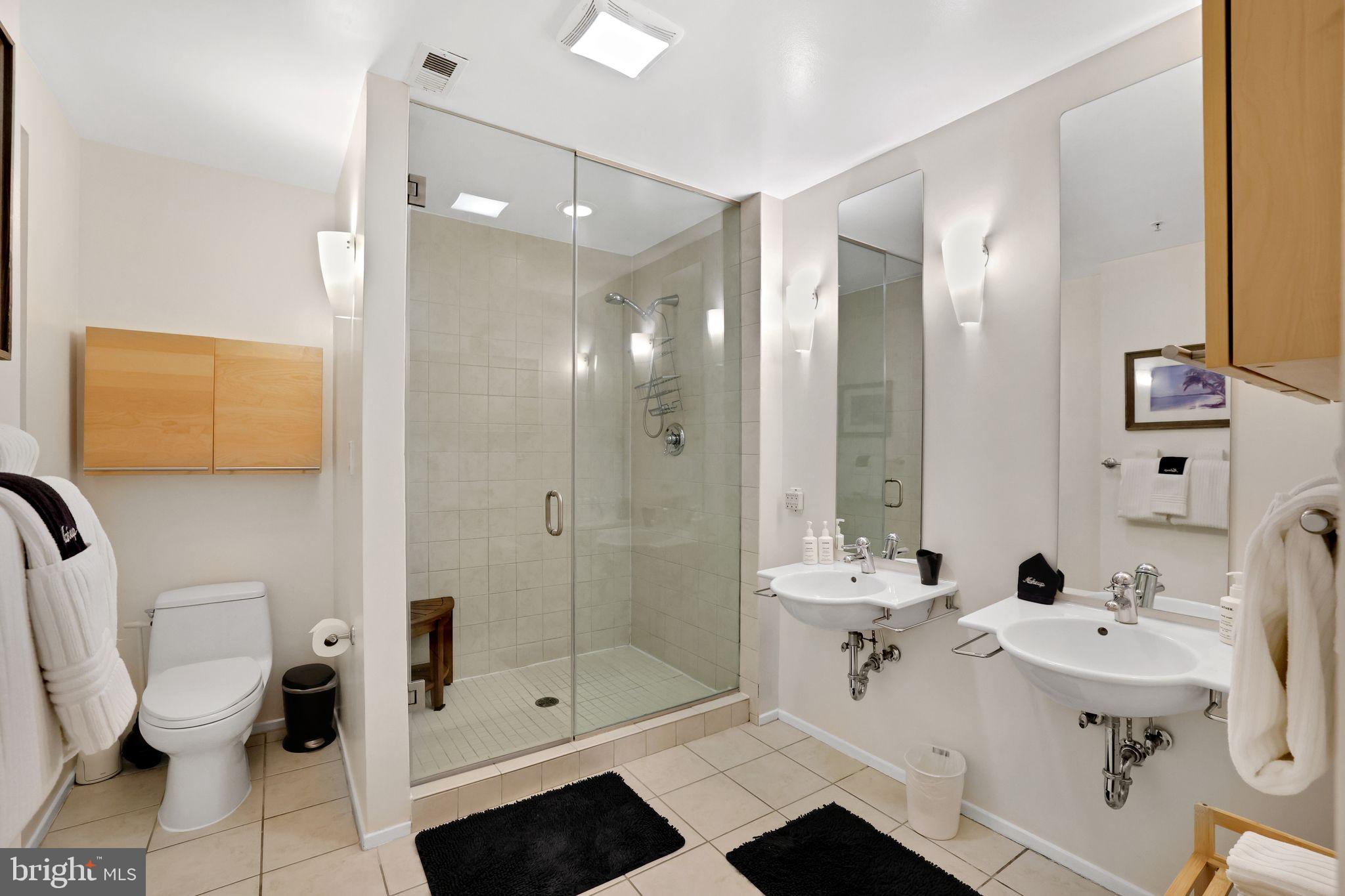 2311 15th Street Northwest, Unit 2 Washington, DC 20009 - Photo 19 of 37 a bathroom with a sink a toilet and shower