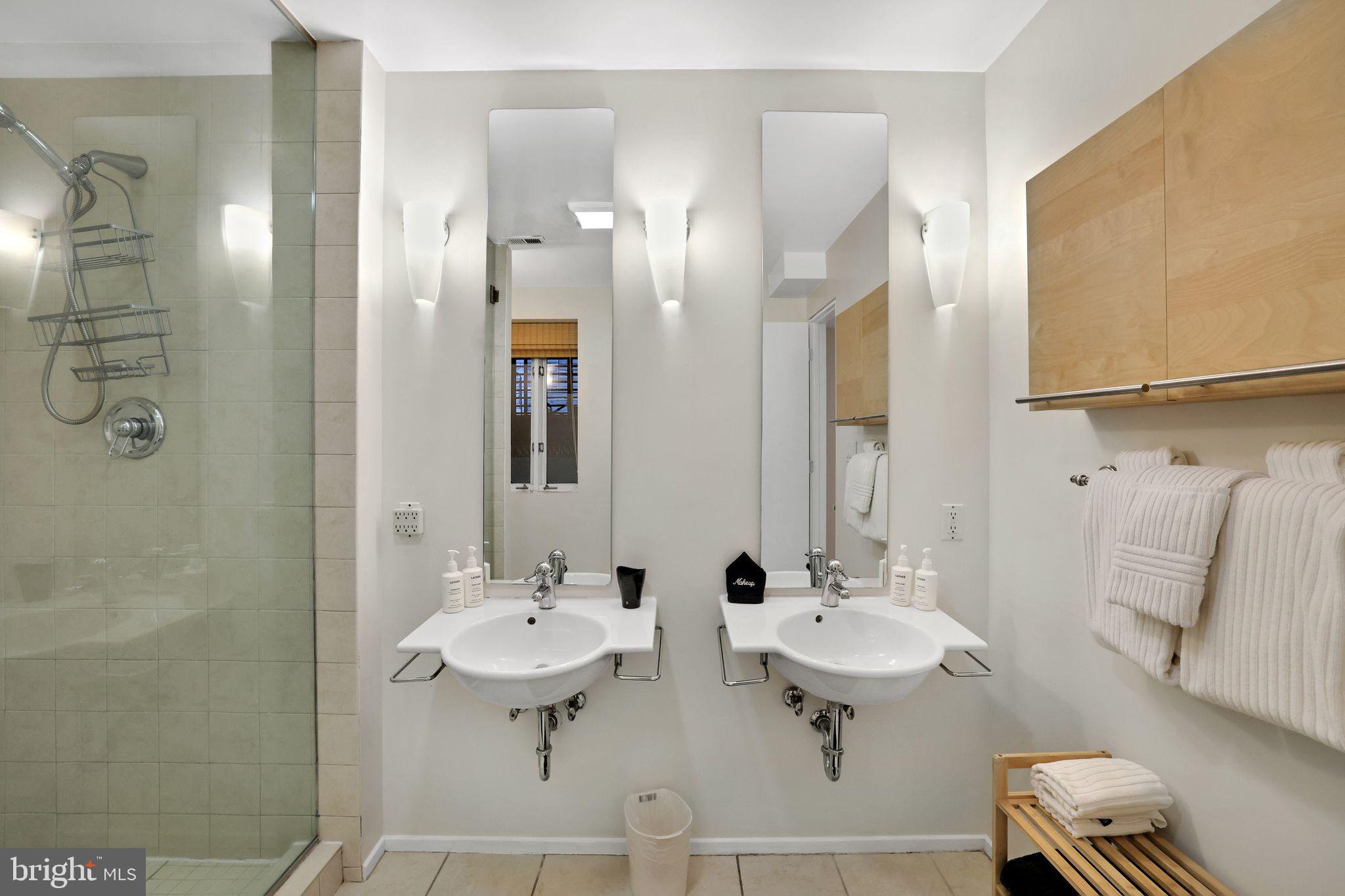 2311 15th Street Northwest, Unit 2 Washington, DC 20009 - Photo 20 of 37 a bathroom with a sink two mirror and a toilet