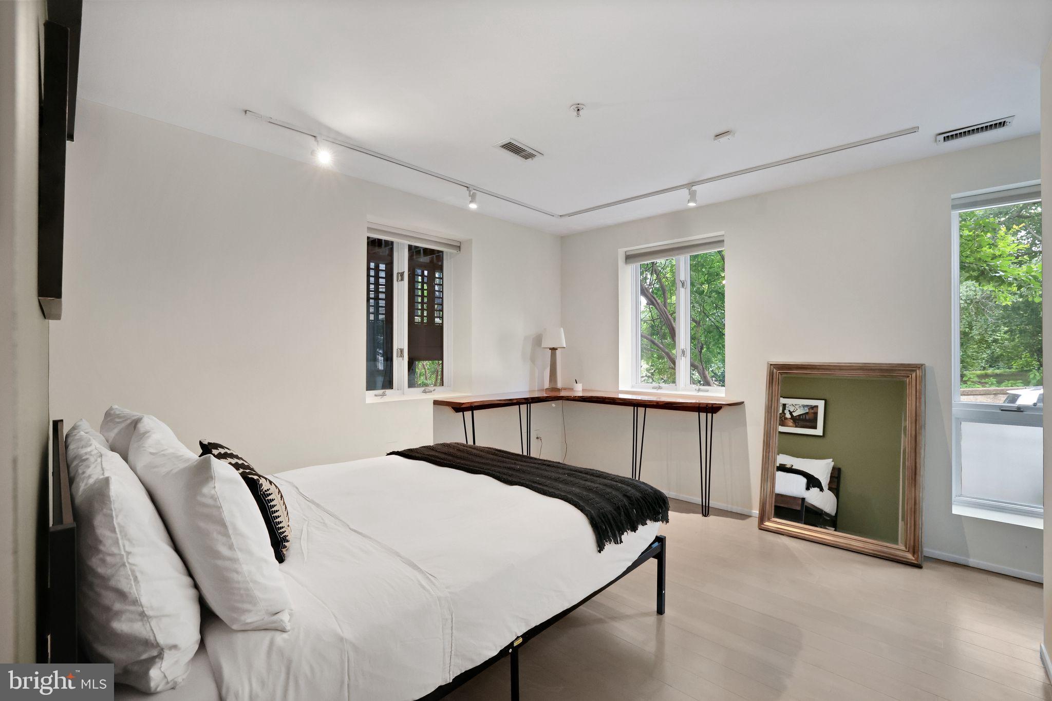 2311 15th Street Northwest, Unit 2 Washington, DC 20009 - Photo 21 of 37 a bedroom with a bed and a window