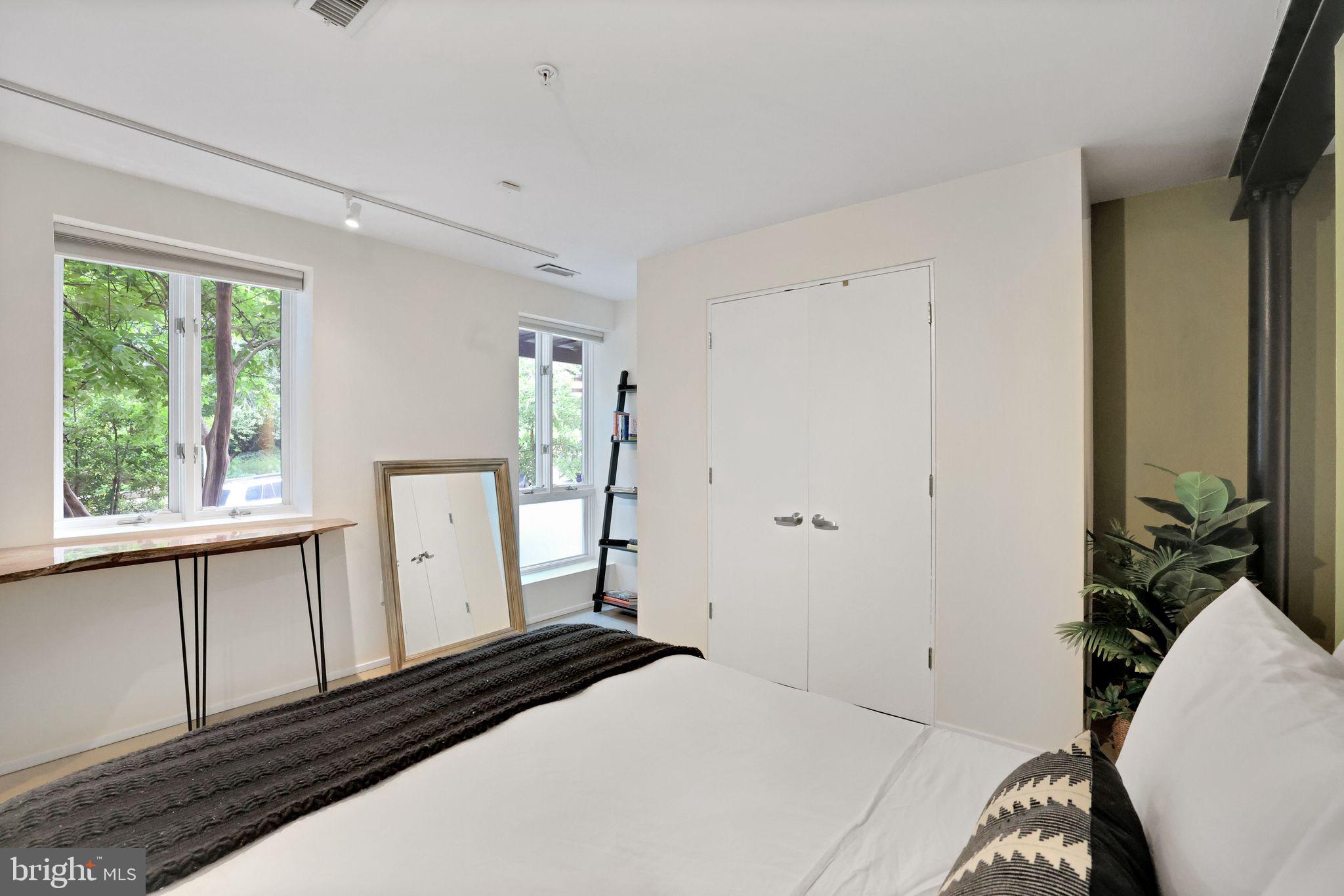 2311 15th Street Northwest, Unit 2 Washington, DC 20009 - Photo 22 of 37 a bedroom with a bed and a large window