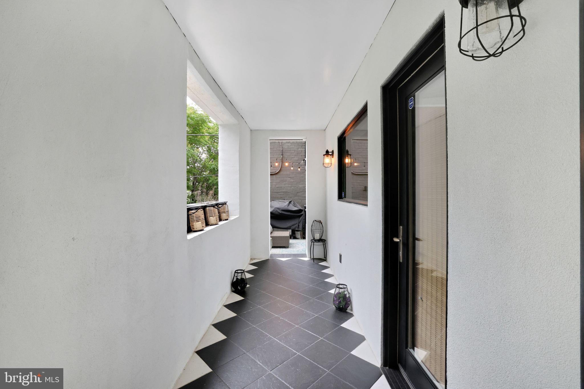 2311 15th Street Northwest, Unit 2 Washington, DC 20009 - Photo 25 of 37 a view of a hallway with wooden floor and staircase