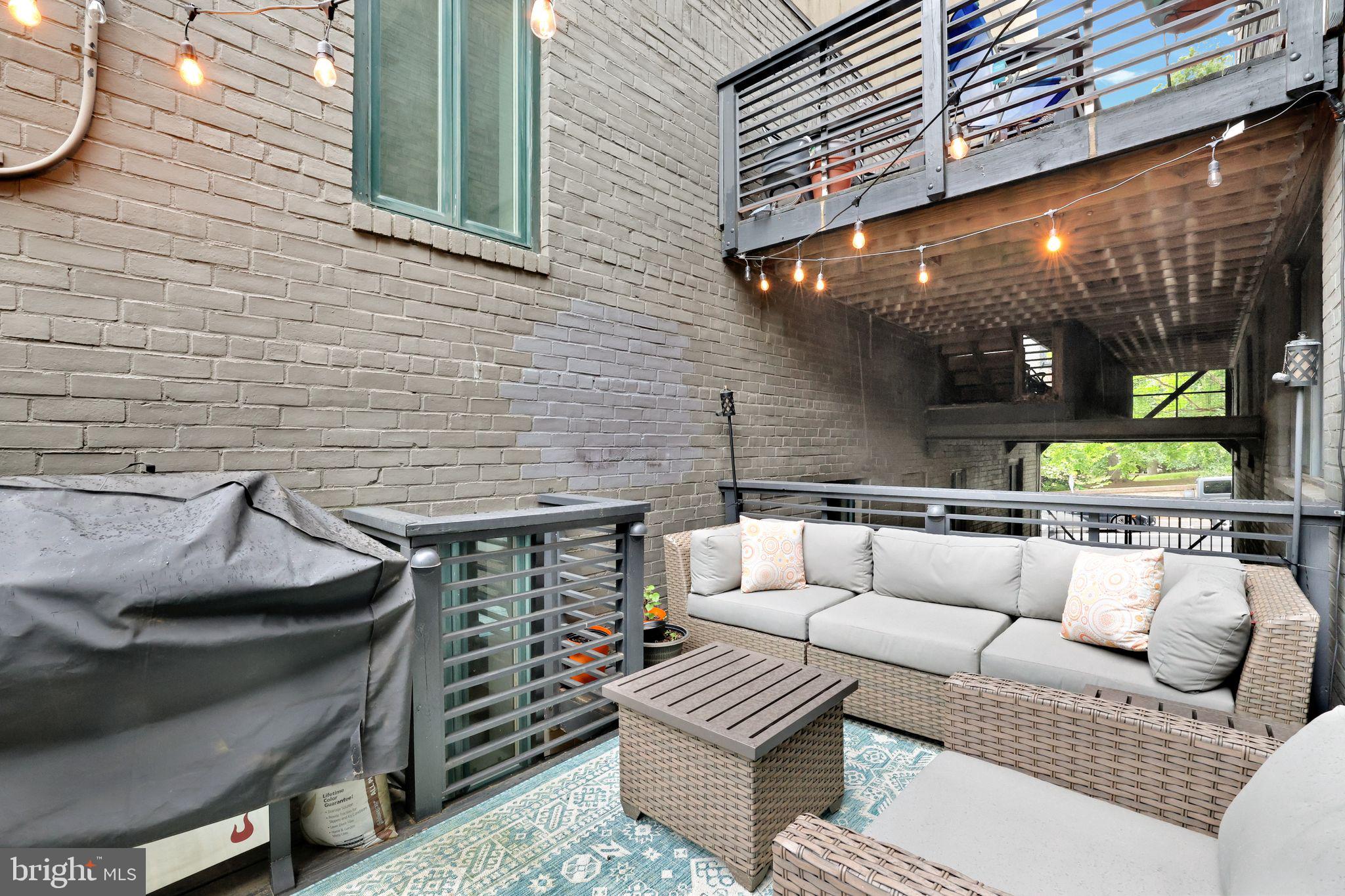2311 15th Street Northwest, Unit 2 Washington, DC 20009 - Photo 26 of 37 a view of a patio with couches and a fire pit