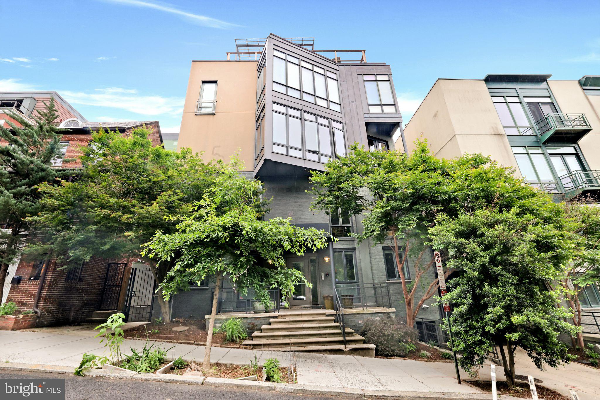 2311 15th Street Northwest, Unit 2 Washington, DC 20009 - Photo 28 of 37 a front view of a house with a yard