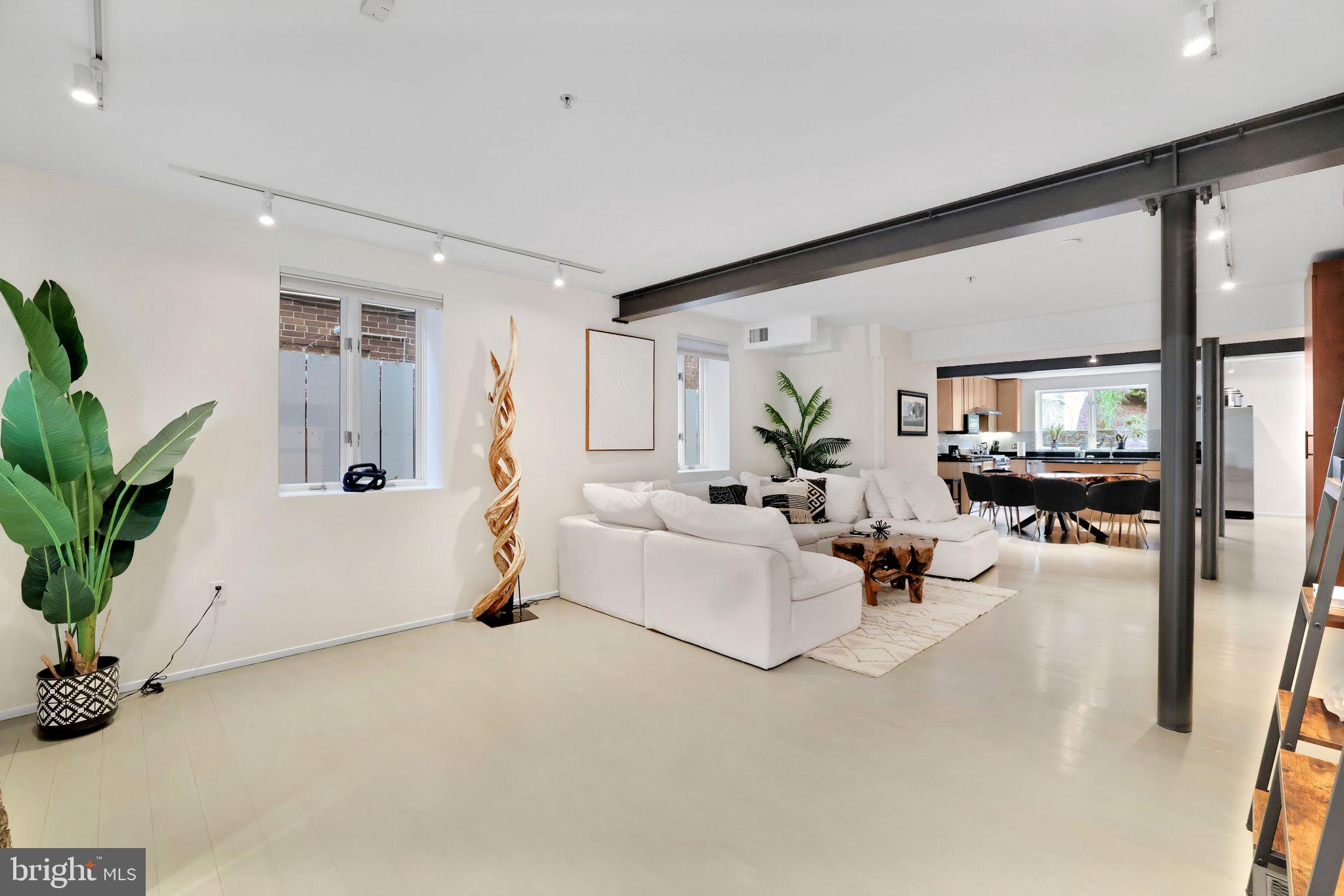 2311 15th Street Northwest, Unit 2 Washington, DC 20009 - Photo 3 of 37 a living room with furniture and a potted plant