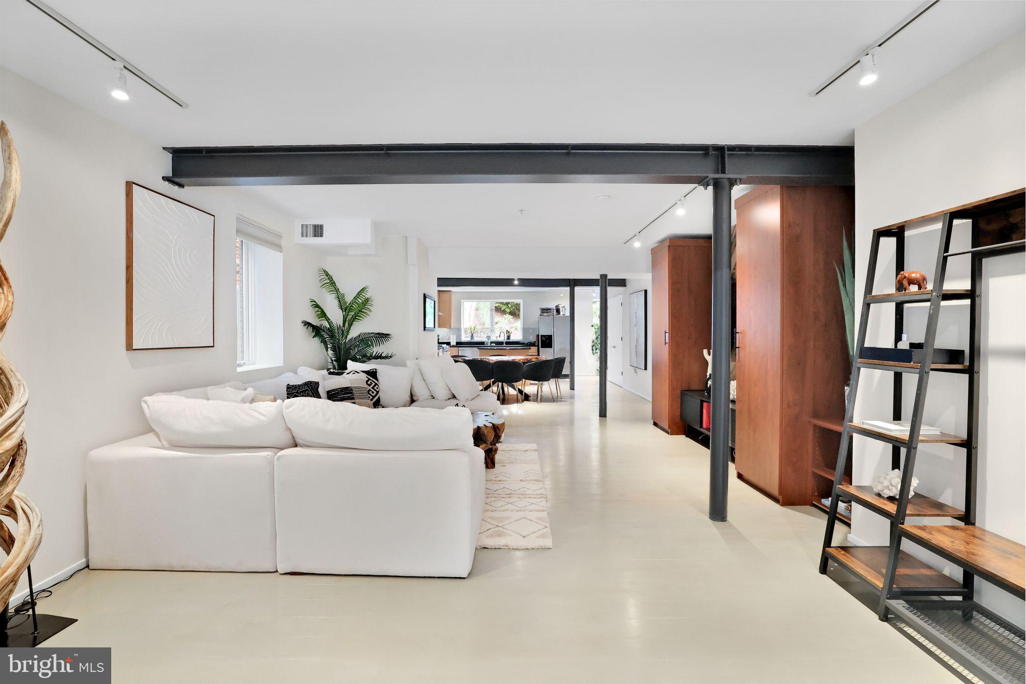 2311 15th Street Northwest, Unit 2 Washington, DC 20009 - Photo 4 of 37 a living room with furniture and a book shelf