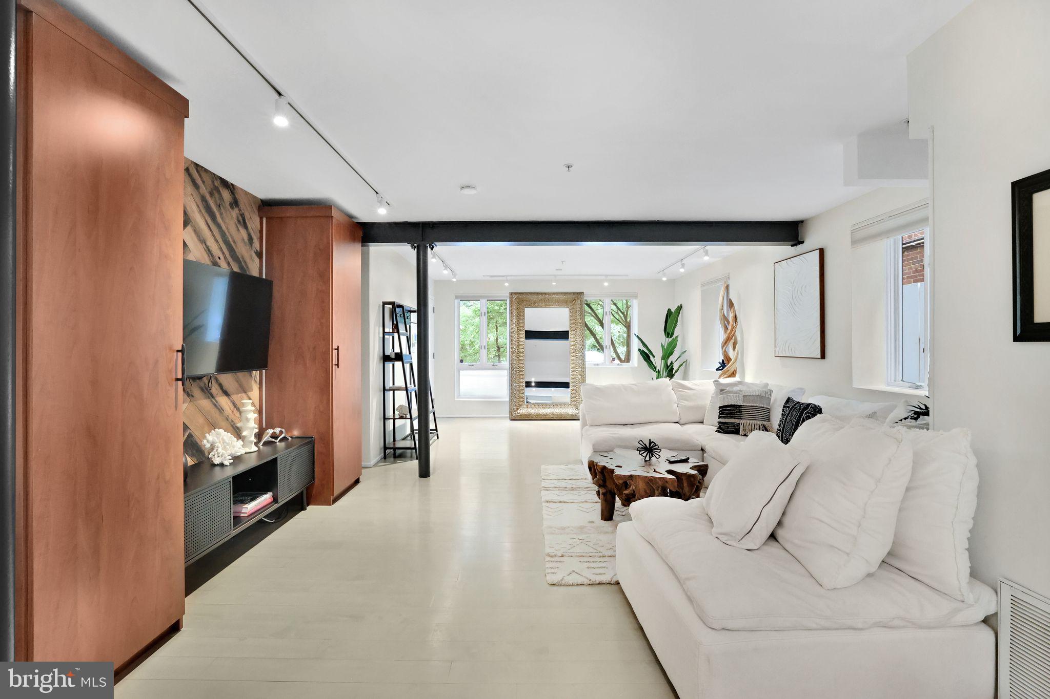 2311 15th Street Northwest, Unit 2 Washington, DC 20009 - Photo 7 of 37 a living room with furniture and a flat screen tv