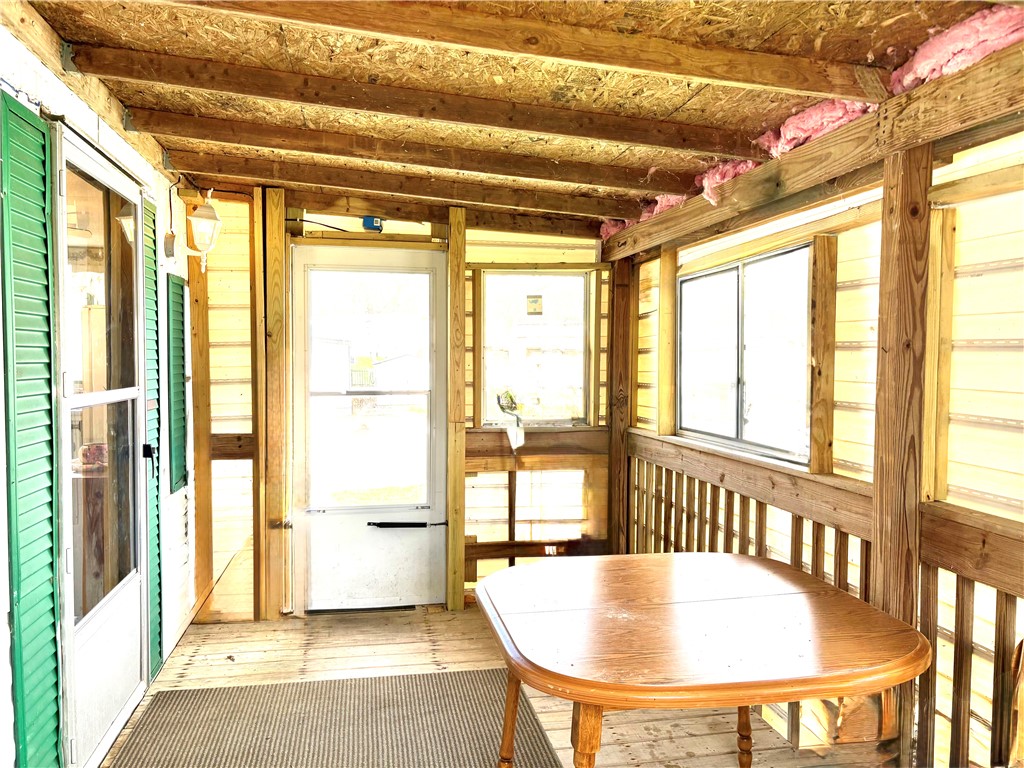 5434 North Waynesville Road, Unit 15 Oregonia, OH 45054 - Photo 17 of 19 Enjoy leisurely moments in this bright and airy enclosed porch, perfect for relaxation.