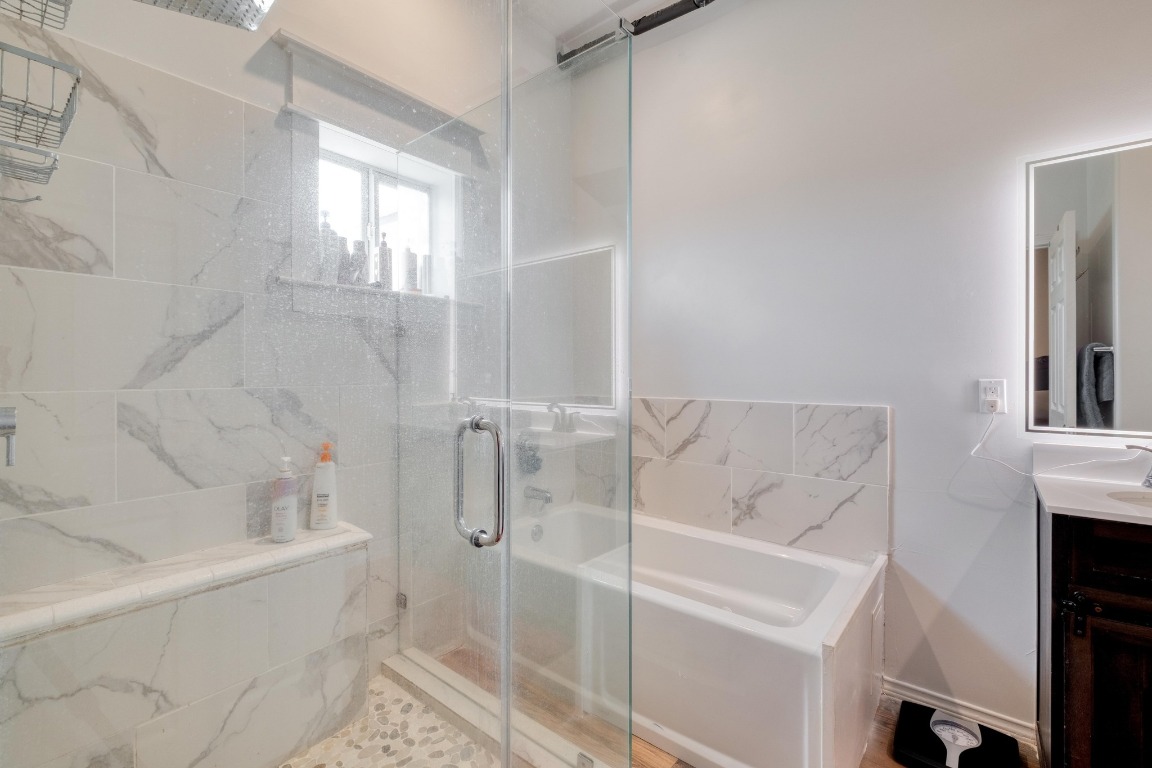 1601 County Road 466 Elgin, TX 78621 - Photo 14 of 39 a bathroom with a bathtub and a sink